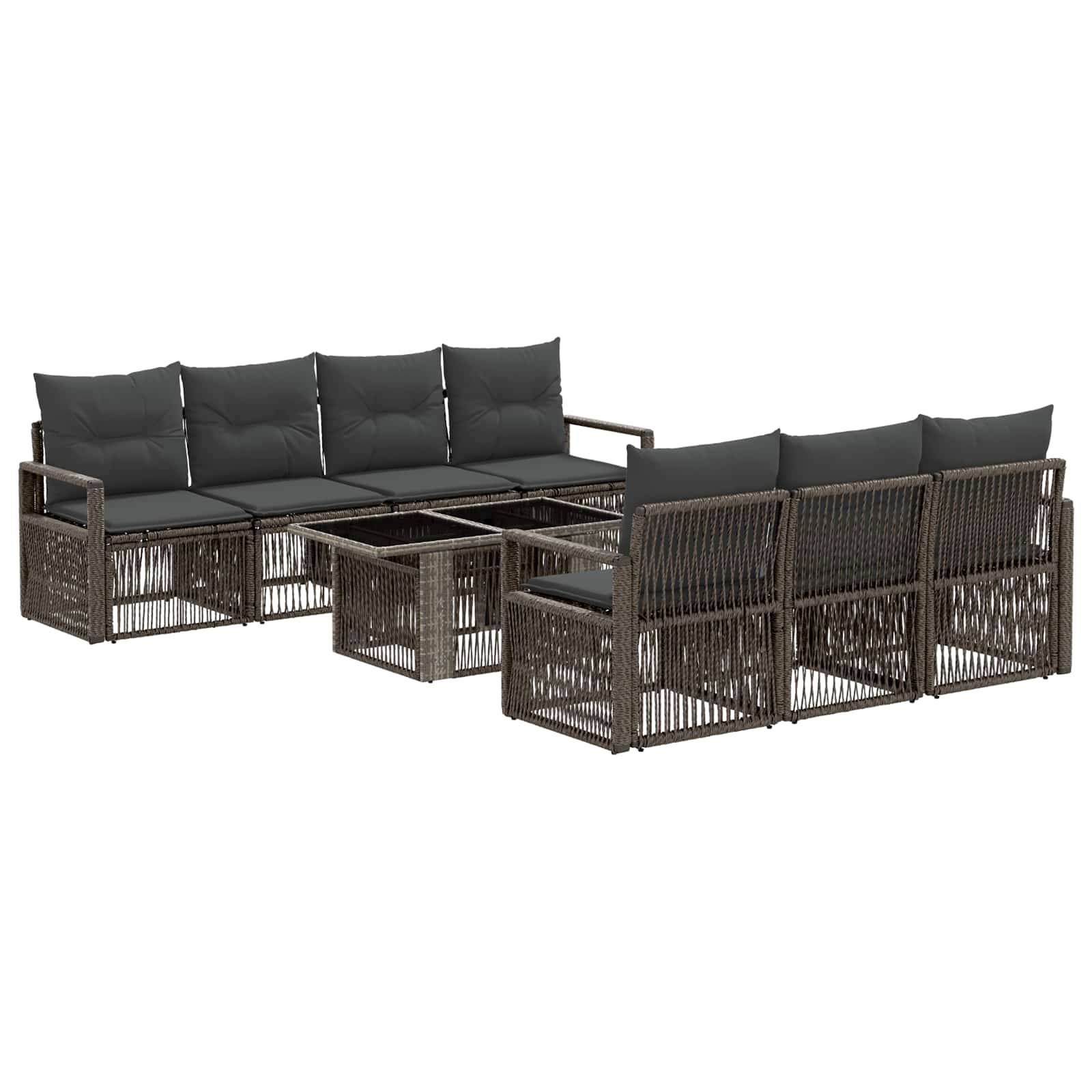 Braunes Gartenmöbel-Loungesofa aus Rattan mit dunklen Kissen und passendem Couchtisch, gezeigt auf weißem Hintergrund.