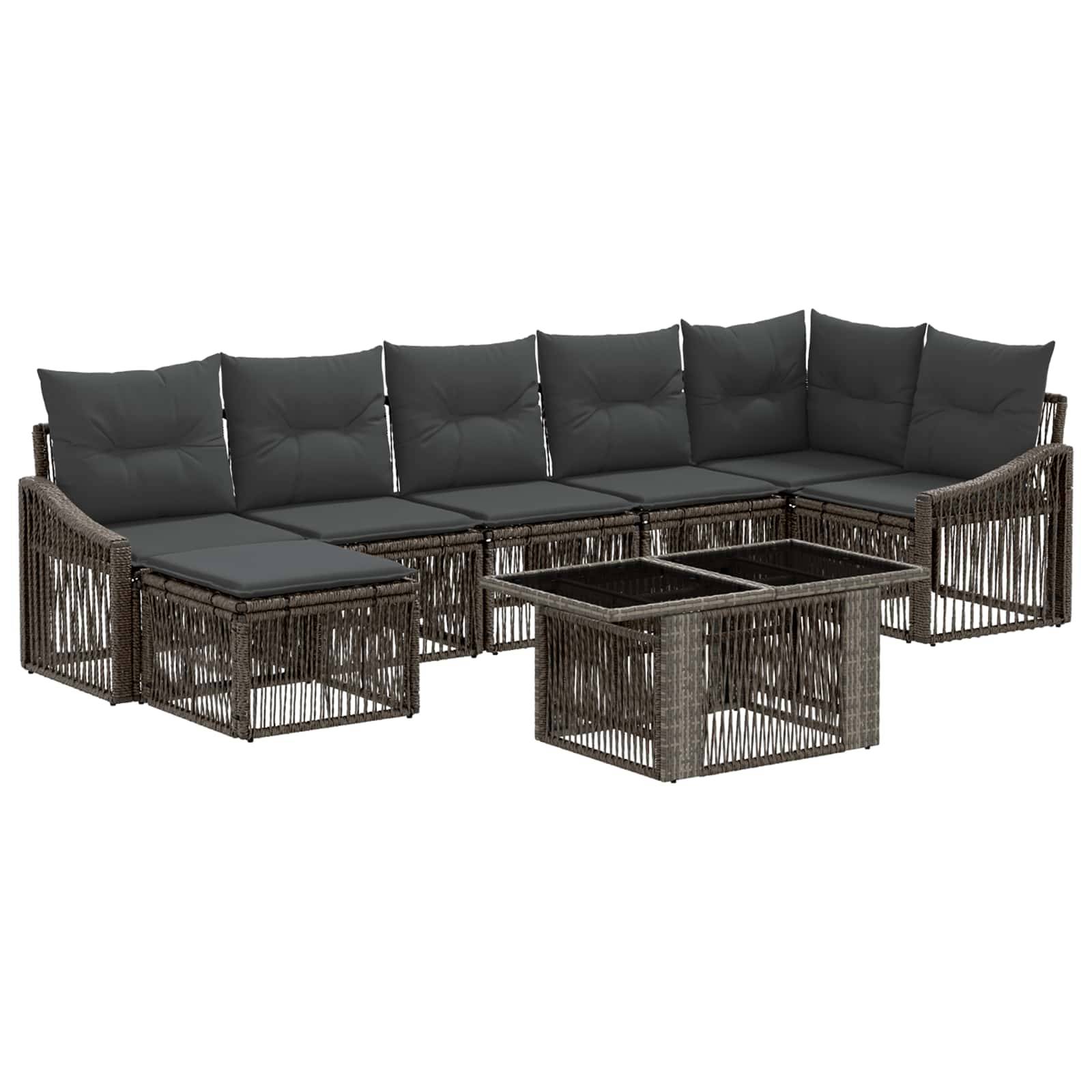 Outdoor-Sektionalsofa aus Rattan mit dunklen Kissen und passendem Glastisch auf weißem Hintergrund