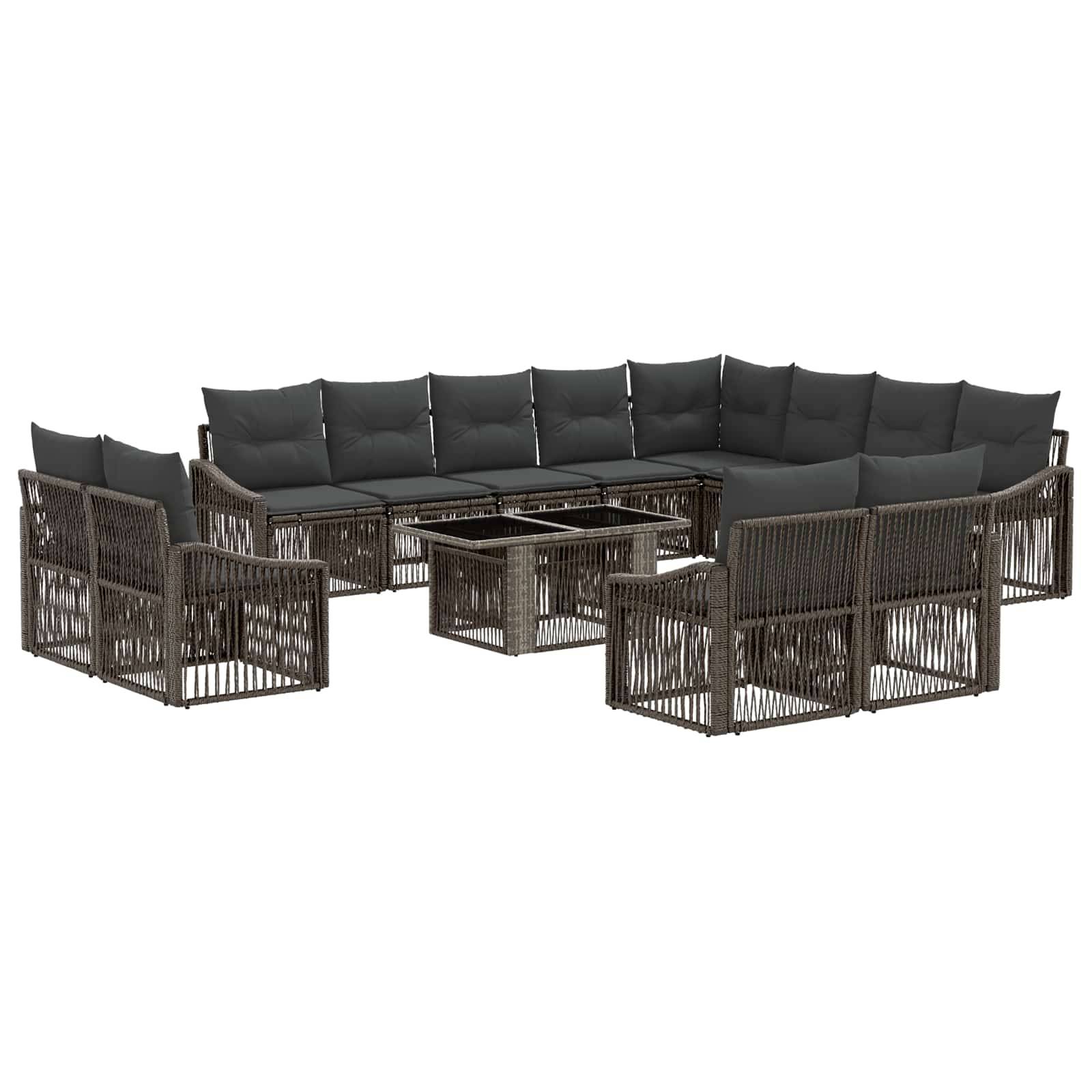 Modulares Outdoor-Lounge-Set aus dunklem Rattan mit grauen Kissen und passendem Glastisch, in U-Form angeordnet.
