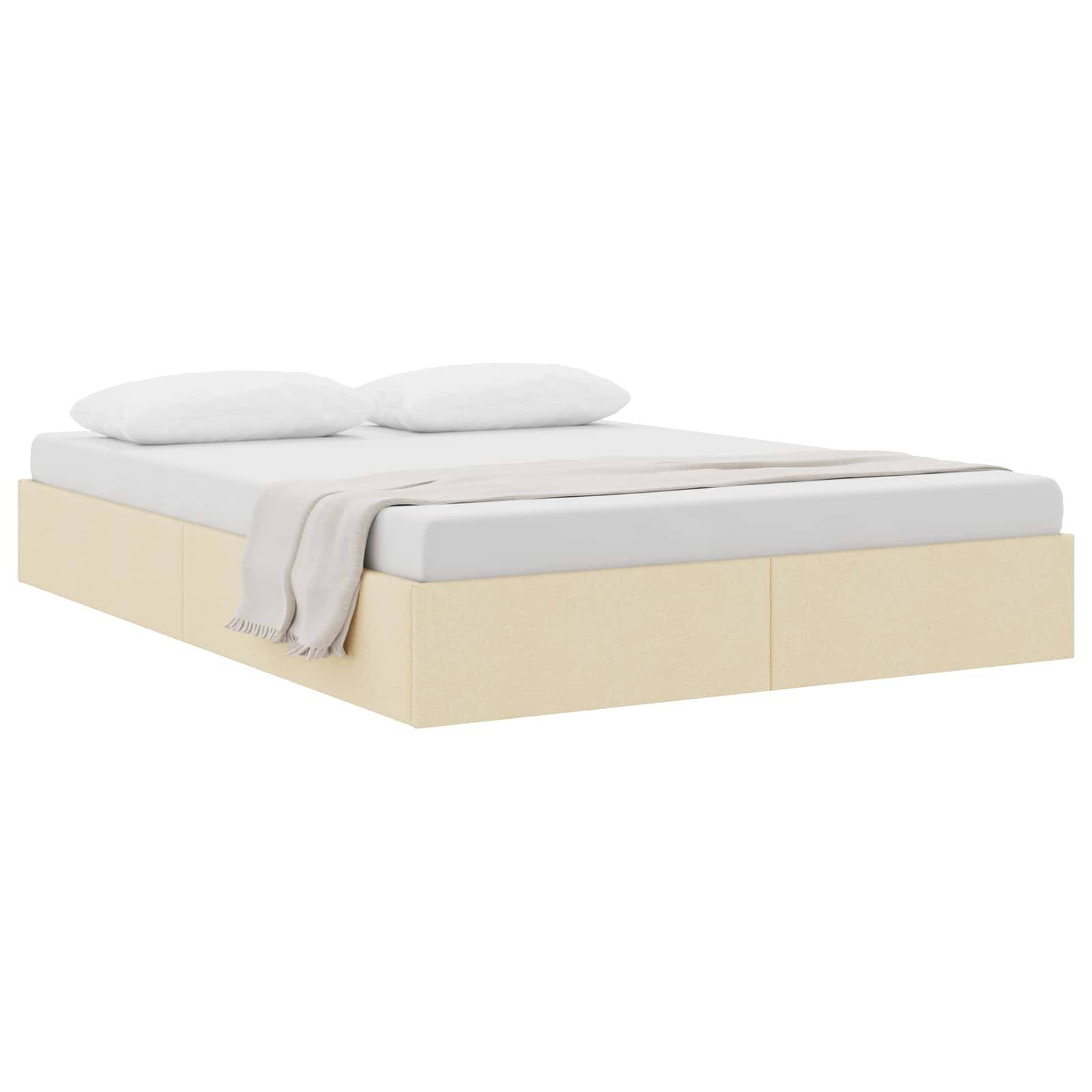Minimalistisches Bett mit beiger Basis, weißer Matratze, zwei Kissen und einer gefalteten Wurfdecke auf weißem Hintergrund.