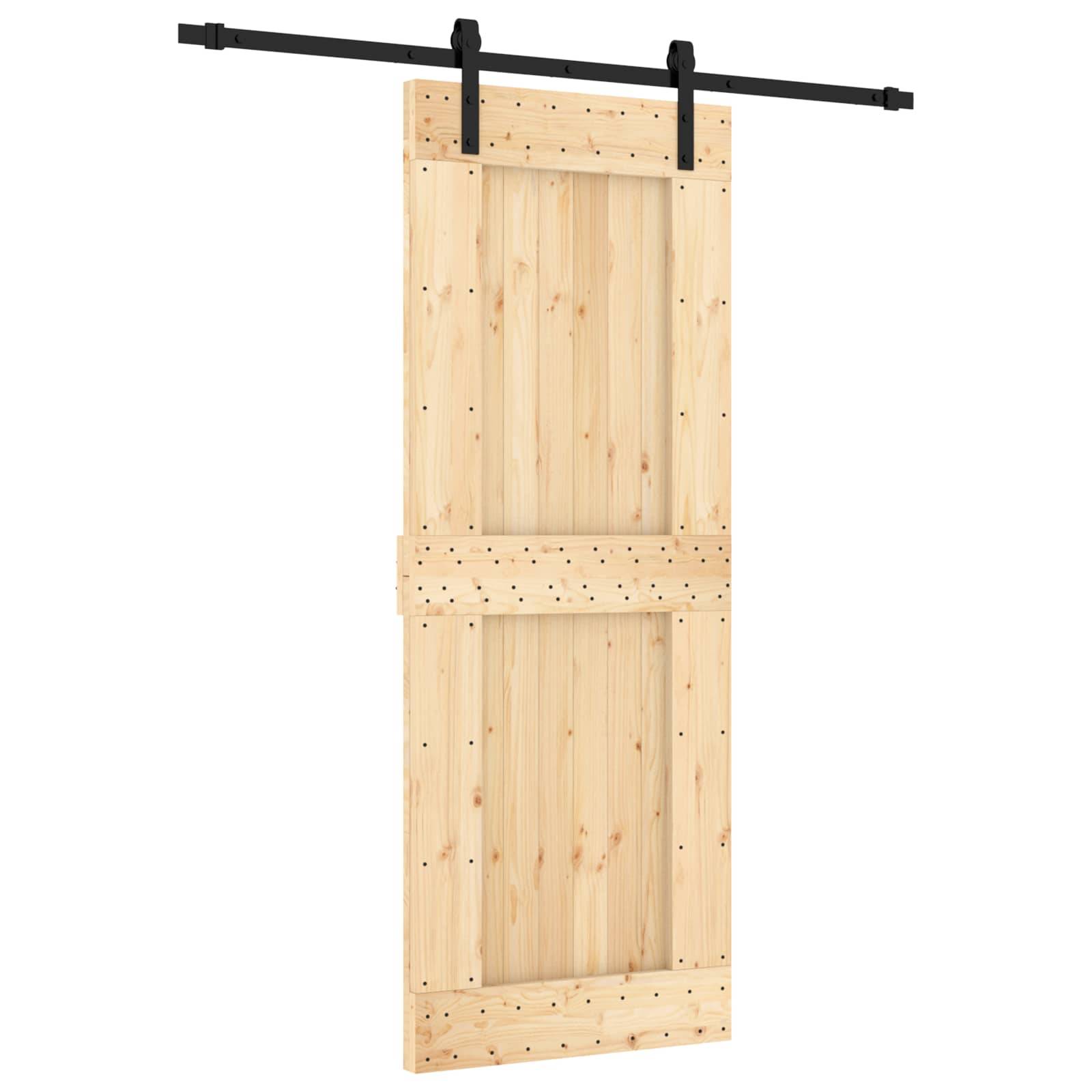 Holzscheunentor-Panel mit schwarzem Schiebewerk oben montiert, isoliert auf weißem Hintergrund dargestellt.