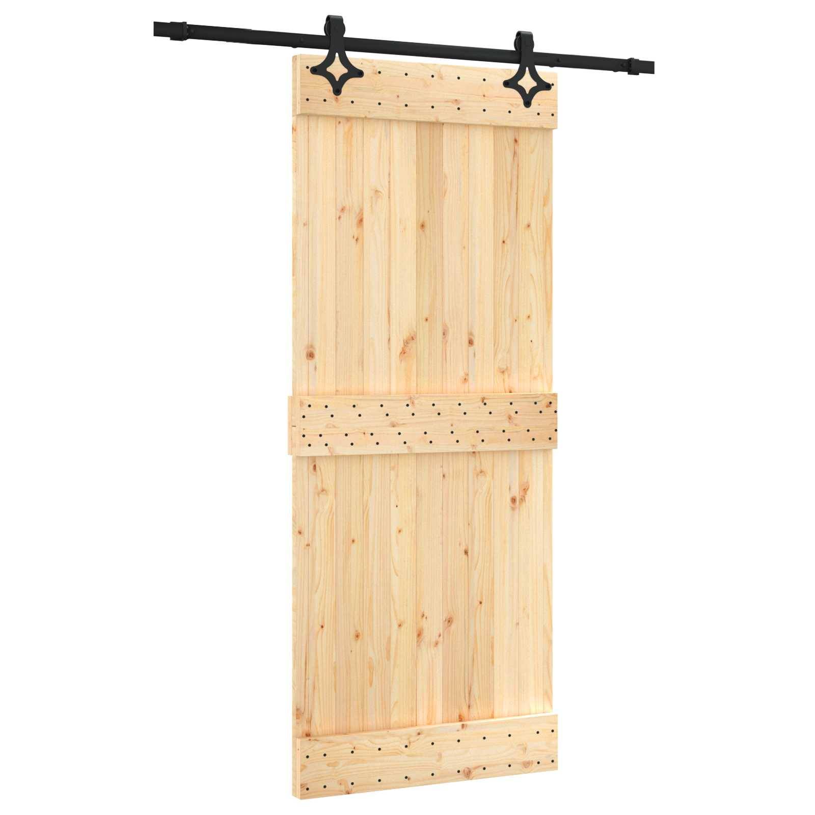 Schiebebare Holzscheunentür mit schwarzer oberer Schienenbeschlagung, unbehandelten Holzpaneelen in heller Farbe und Kreuzbändern auf weißem Hintergrund.