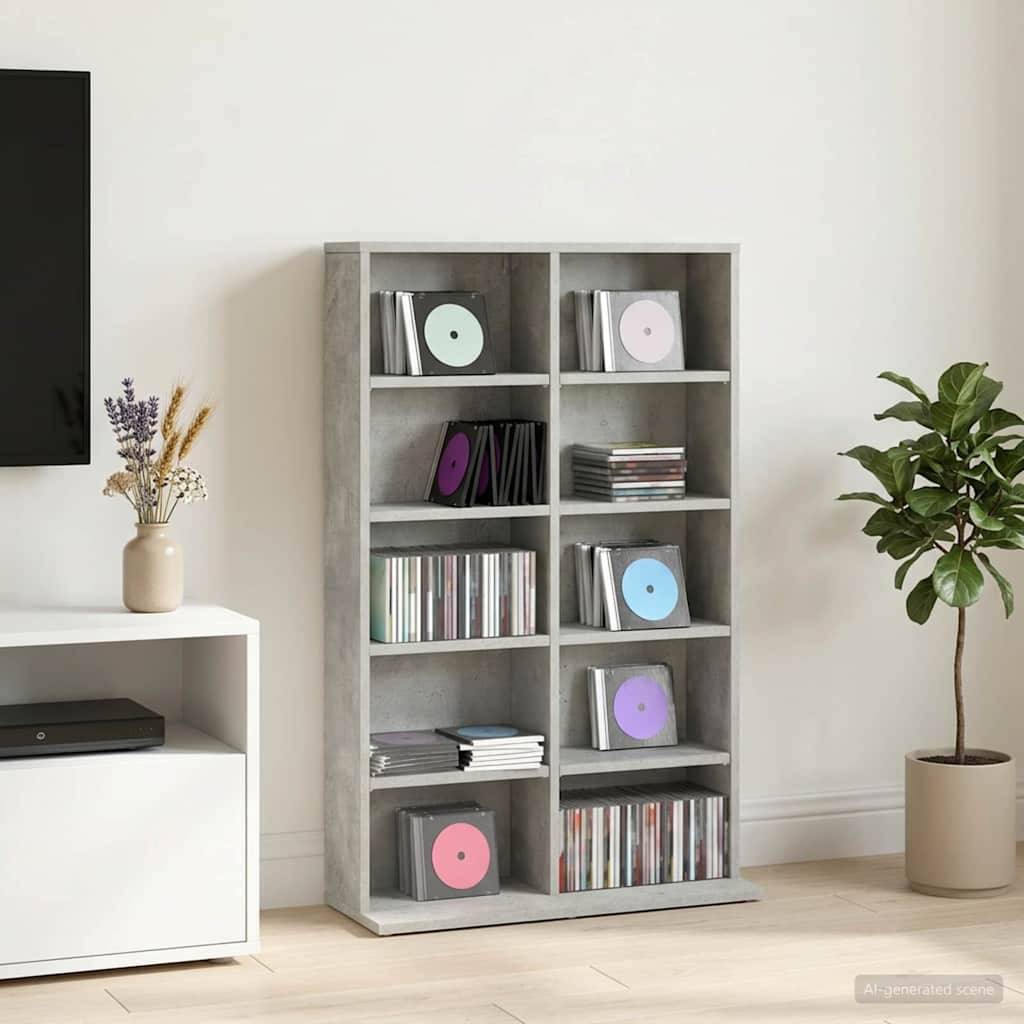 Minimalistisches Wohnzimmer mit einem grauen Regalsystem gefüllt mit Schallplatten und CDs, einem weißen Medienschrank, einer Vase mit Trockenblumen und einer Topfpflanze.