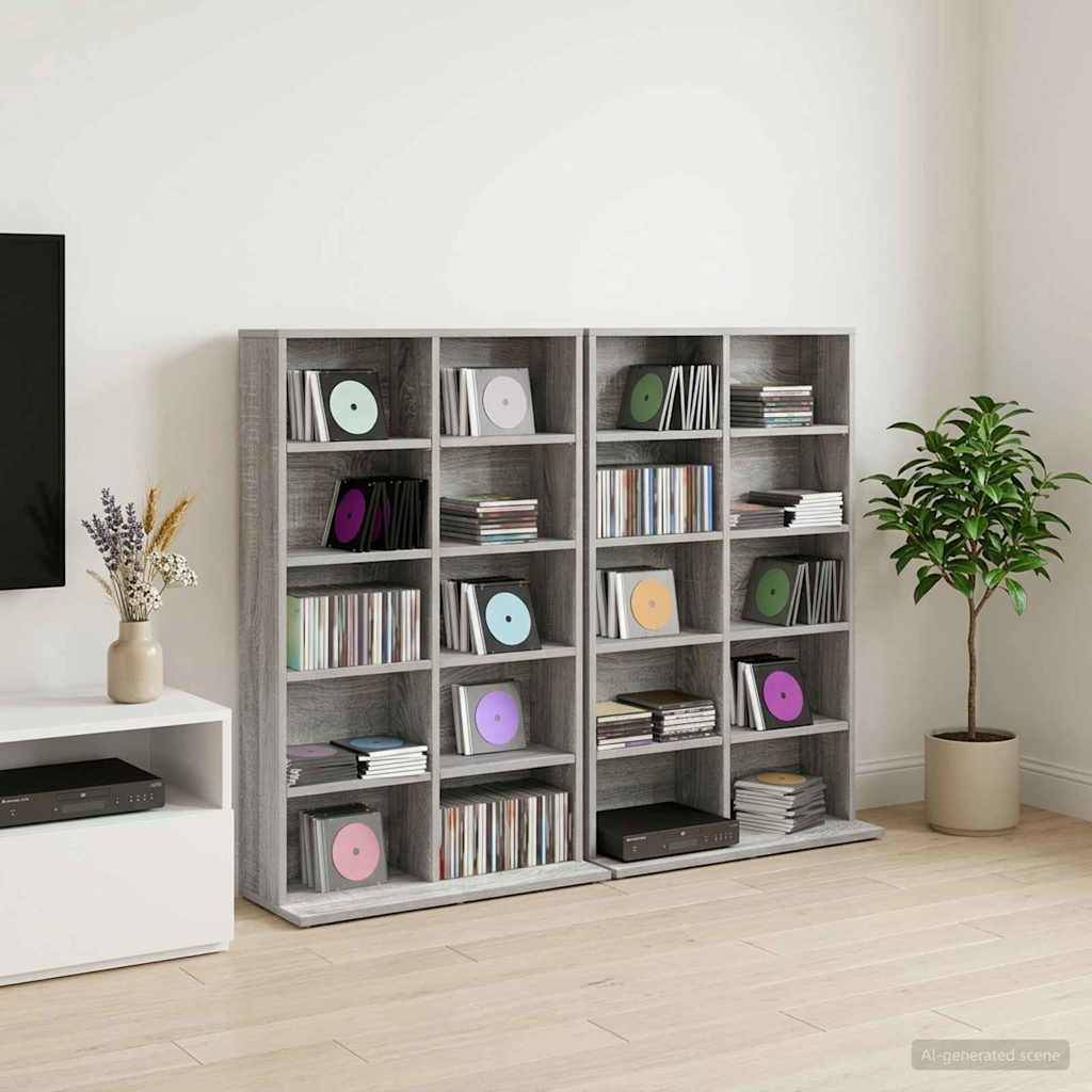 Graue Regale mit Fächern voller Schallplatten, Bücher und Medienstapel neben einer Topfpflanze in einem minimalistischen Wohnzimmer.