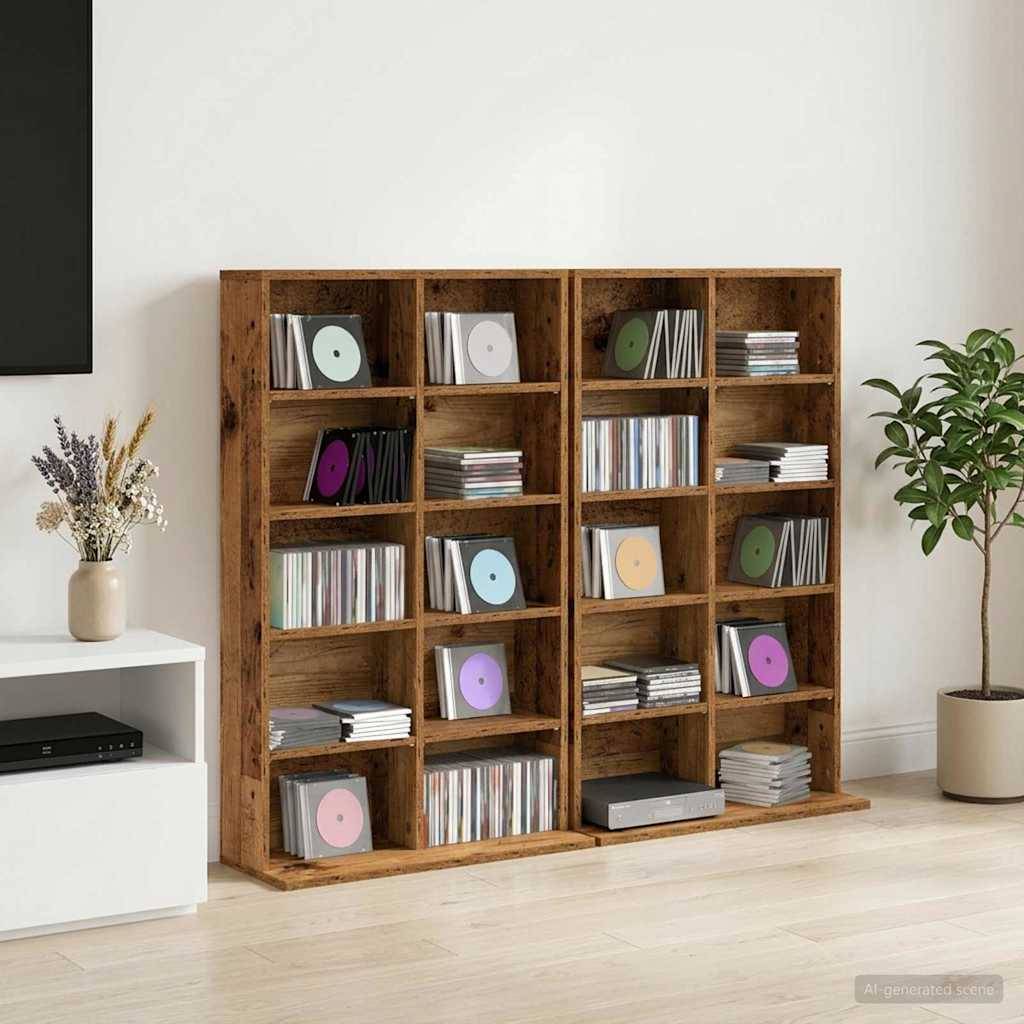 Holzregale mit Schließfächern gefüllt mit Schallplatten, CDs und Stapeln von Medien in einem minimalistischen Raum mit einer Pflanze und einem kleinen Beistelltisch.