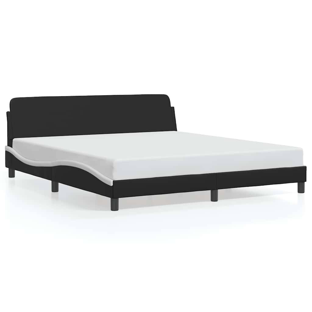 Schwarzes gepolstertes Plattformbett mit weißer Matratze auf einfachem weißem Hintergrund.