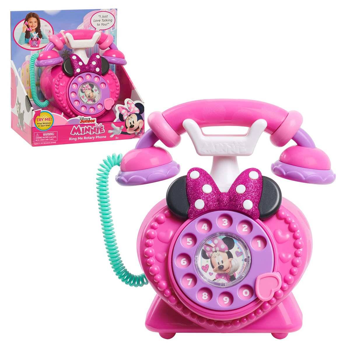 Rosa Minnie Maus Spielzeug-Klingeltelefon mit Wählscheibe, Schnurhörer und Originalverpackung daneben abgebildet.