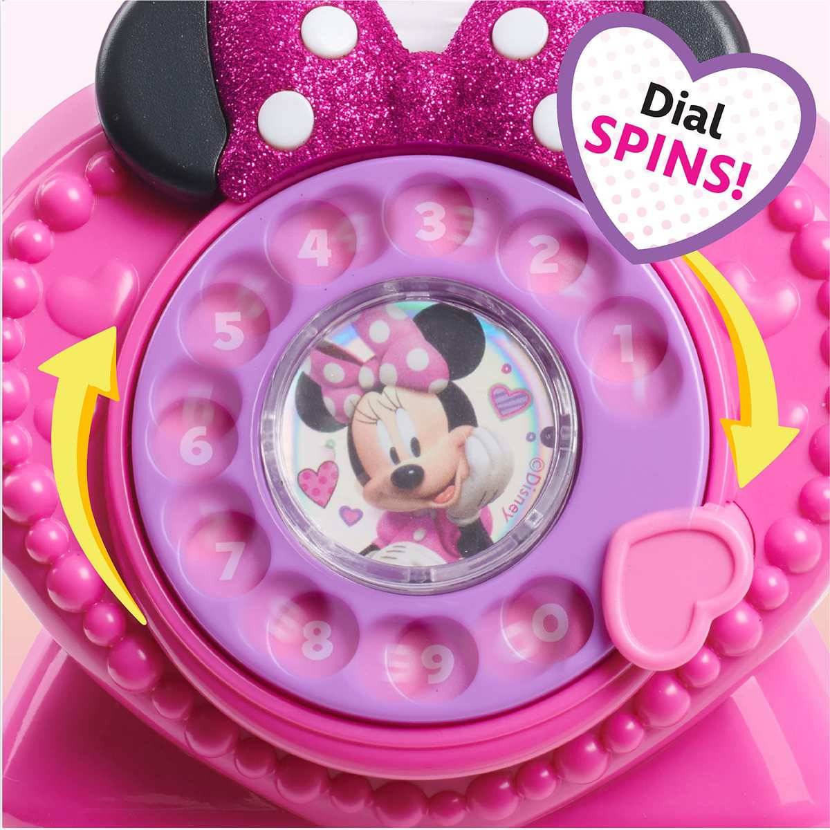 Rosa Minnie-Maus-Spielzeugtelefon mit Wählscheibe, nummerierten Tasten und einem herzförmigen „WÄHLSCHEIBE DREHT SICH!