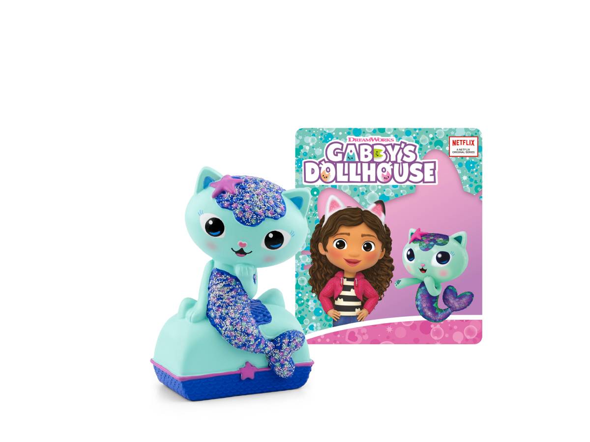 Gabby's Dollhouse Spielzeugfigur mit einer glitzernden türkisfarbenen Katzenfigur vor der Produktbox, die Gabby und die Figur zeigt.