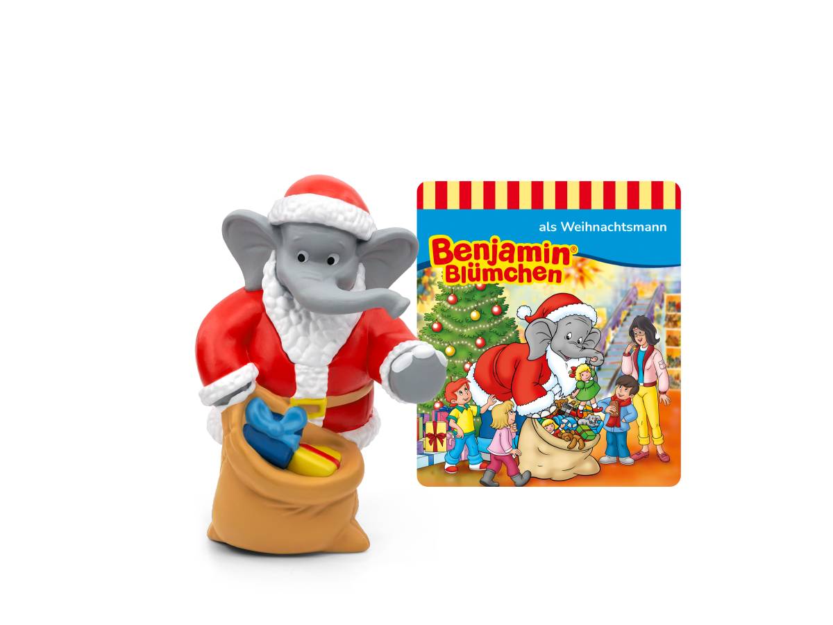 Ein in Santa-Kleidung gekleidetes Elefantenfigürchen steht neben einem „Benjamin Blümchen