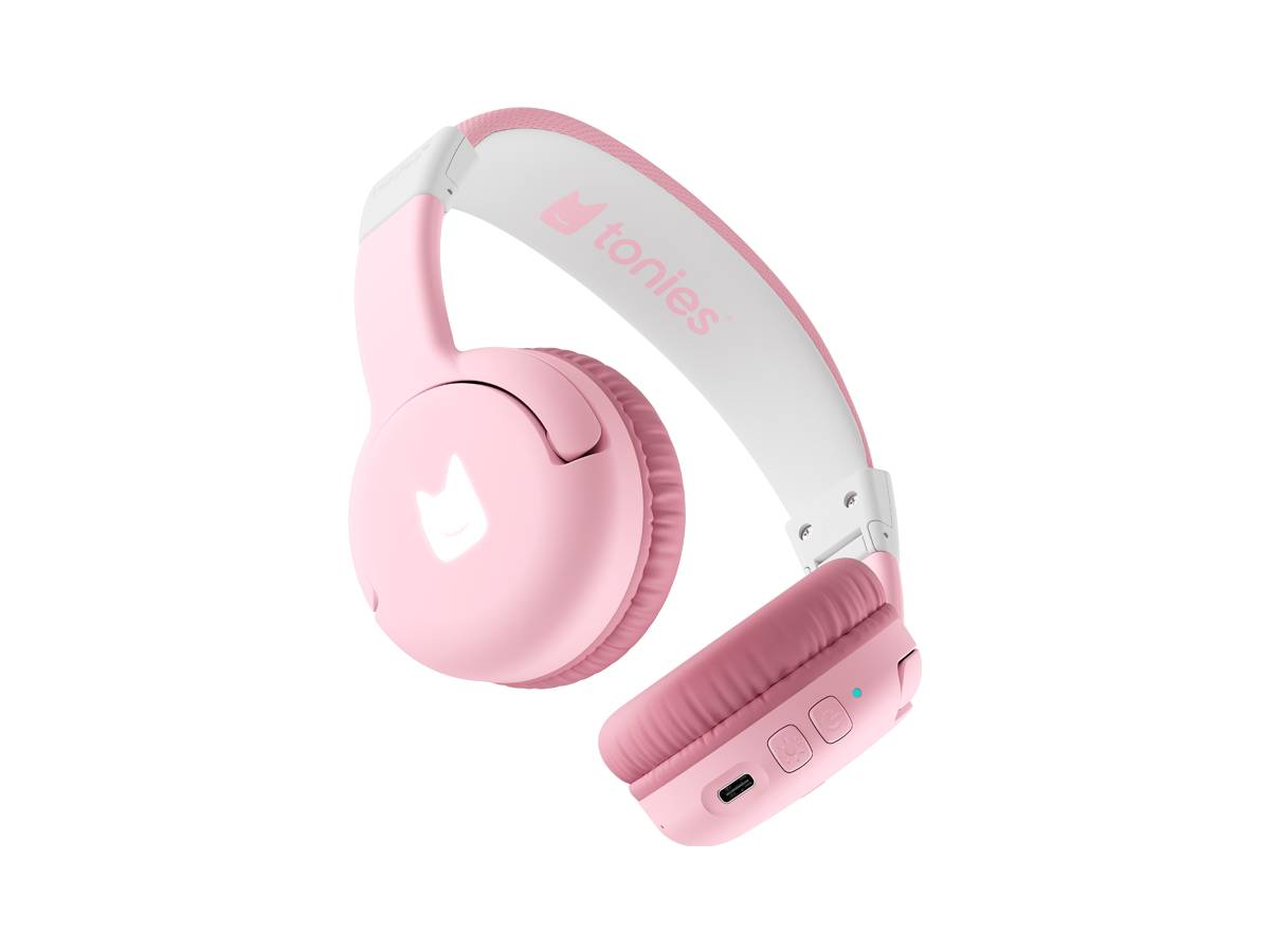 Rosa und weiße Tonies Over-Ear-Kopfhörer auf schwarzem Hintergrund.