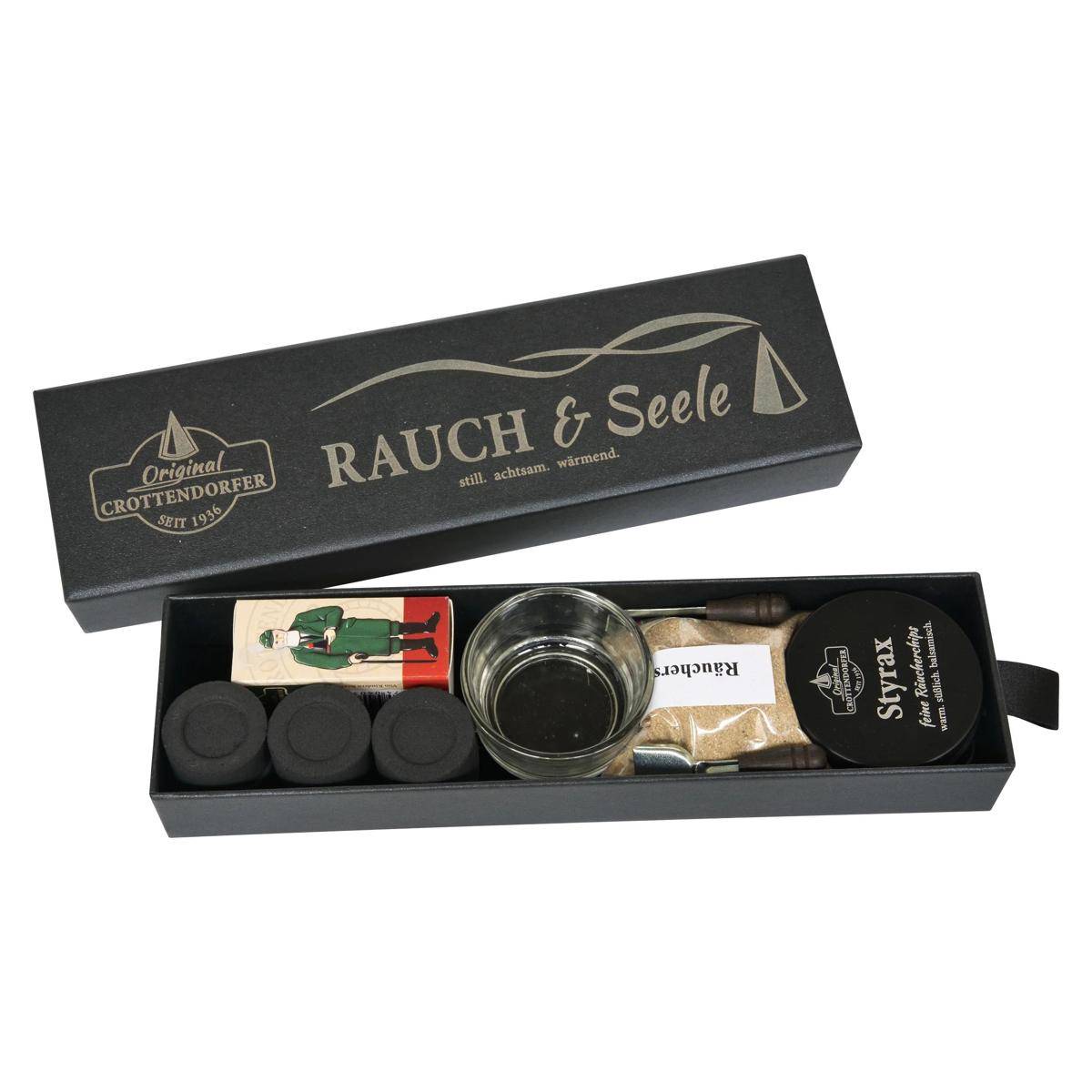 Offene Geschenkboxset mit der Bezeichnung „RAUCH & Seele