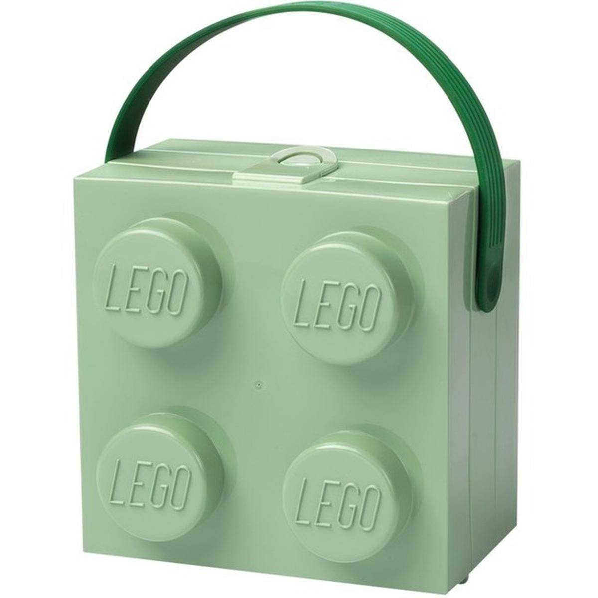 Hellgrüne LEGO-förmige Brotdose mit vier stiftähnlichen Kreisen und grünem Griff oben.