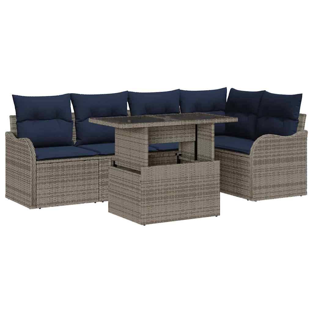 Outdoor-Rattanecksofa mit marineblauen Kissen und passendem Couchtisch mit Hubdeckel.