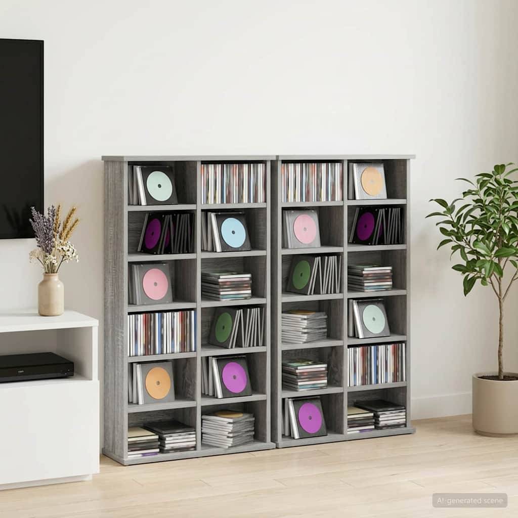 Graue Lagerschränke gefüllt mit Schallplatten und Stapeln von Schallplatten, gezeigt in einem minimalistischen Raum mit einer Pflanze und einem Beistelltisch.