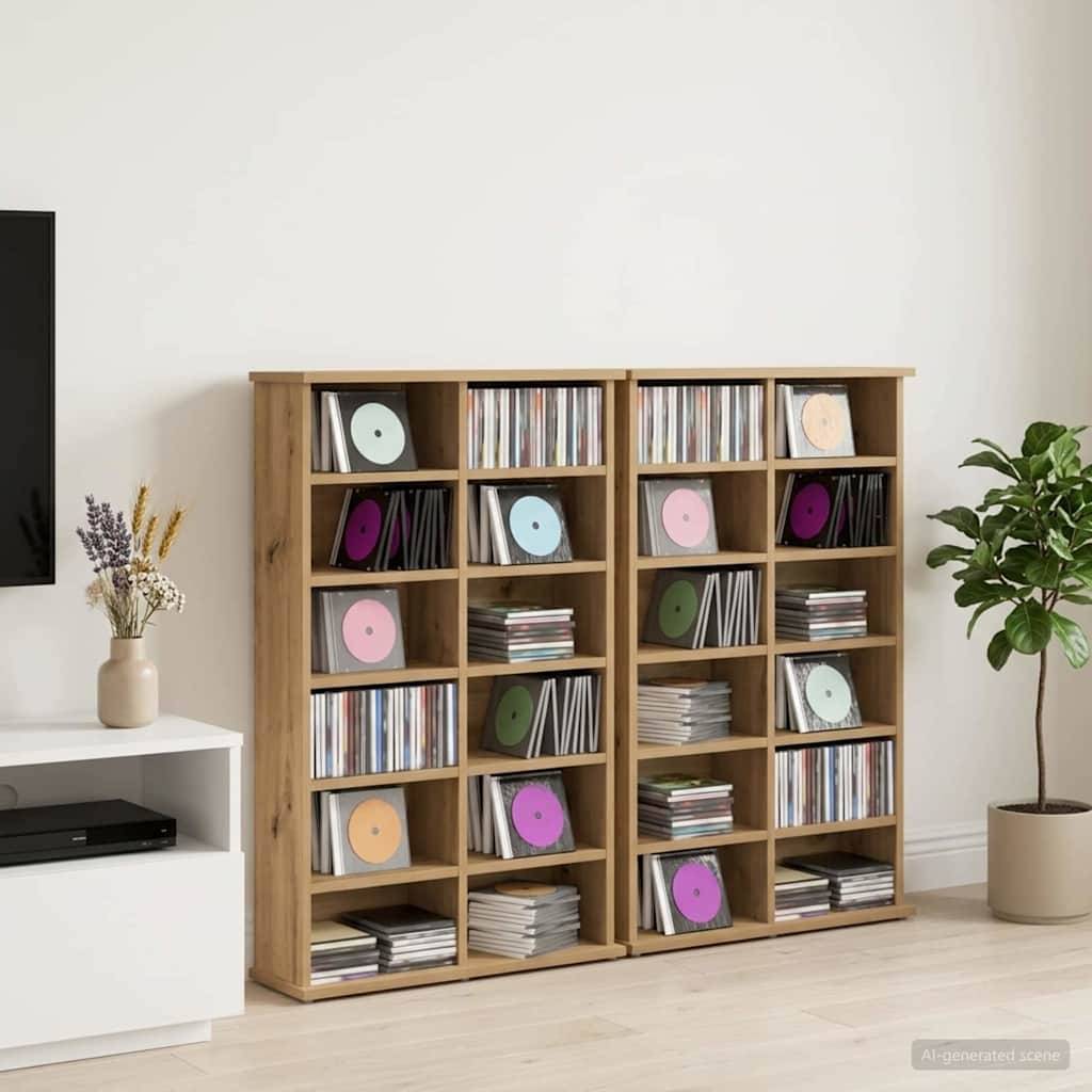 Zwei hölzerne Würfel-Regalsysteme gefüllt mit Schallplatten und gestapelten Alben in einem minimalistischen Wohnzimmer, mit einem TV-Ständer und einer Topfpflanze in der Nähe.