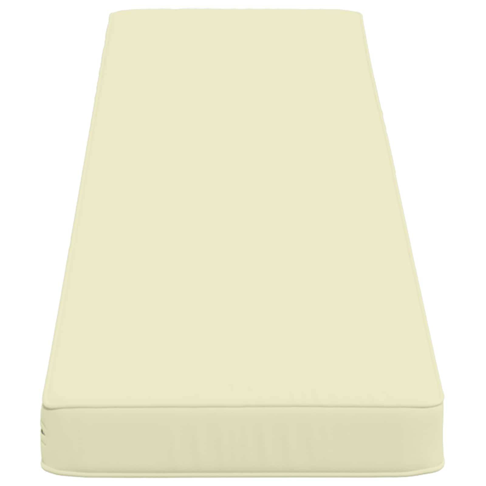 Beige rechteckiges Schaumstoff-Kissen oder Matratzenauflage mit verjüngten Seiten auf einfachem Hintergrund.