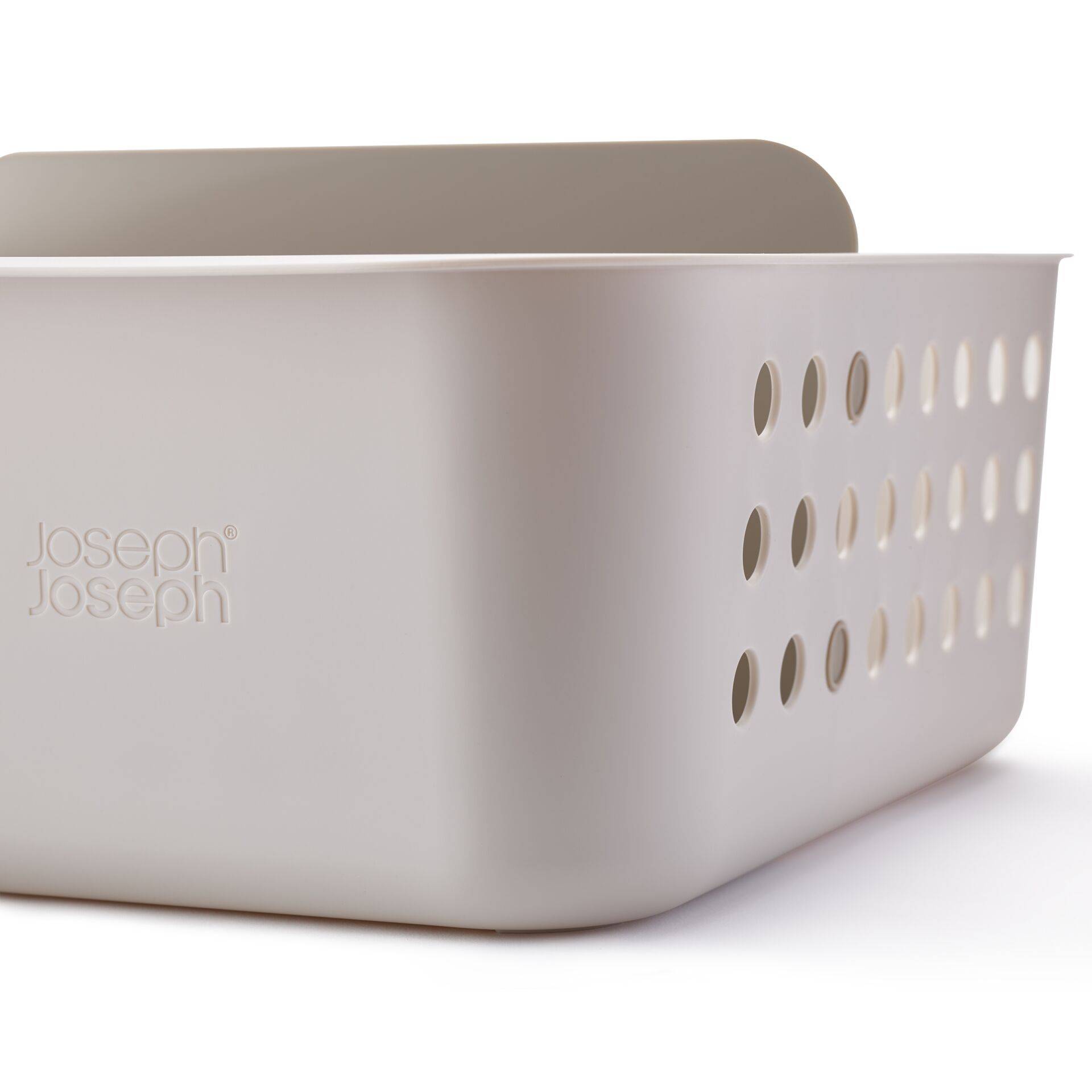 Weiße Joseph Joseph Kunststoff-Aufbewahrungskorb mit perforierten Seiten und Griff, gezeigt auf einem schlichten weißen Hintergrund.