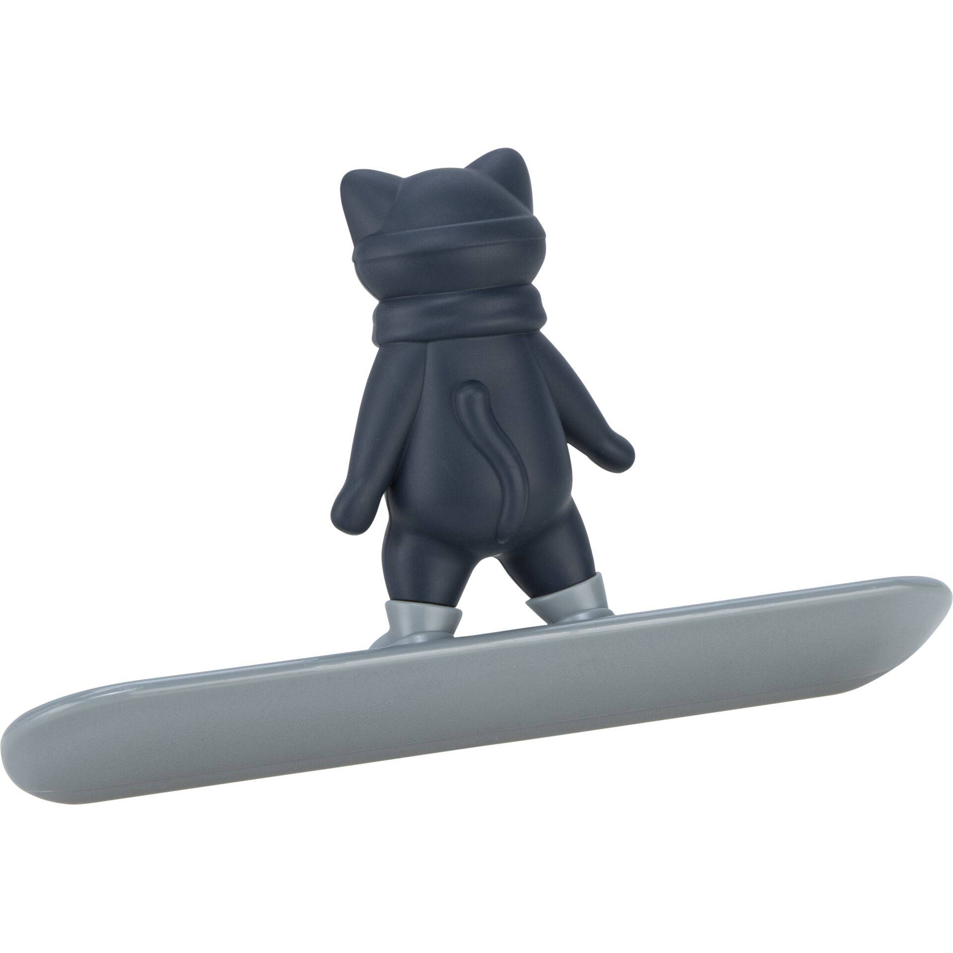 Kleine schwarze katzenförmige Figur, die auf einer grauen, surfbrettähnlichen Basis gegen einen weißen Hintergrund steht.