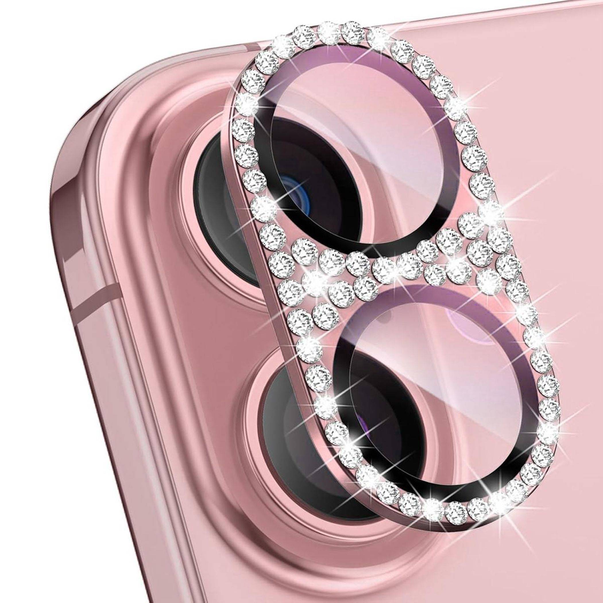 Nahaufnahme einer rosa Smartphone-Kamera mit einem funkelnden Strass-Dual-Linsen-Schutz, der die hinteren Linsen abdeckt.