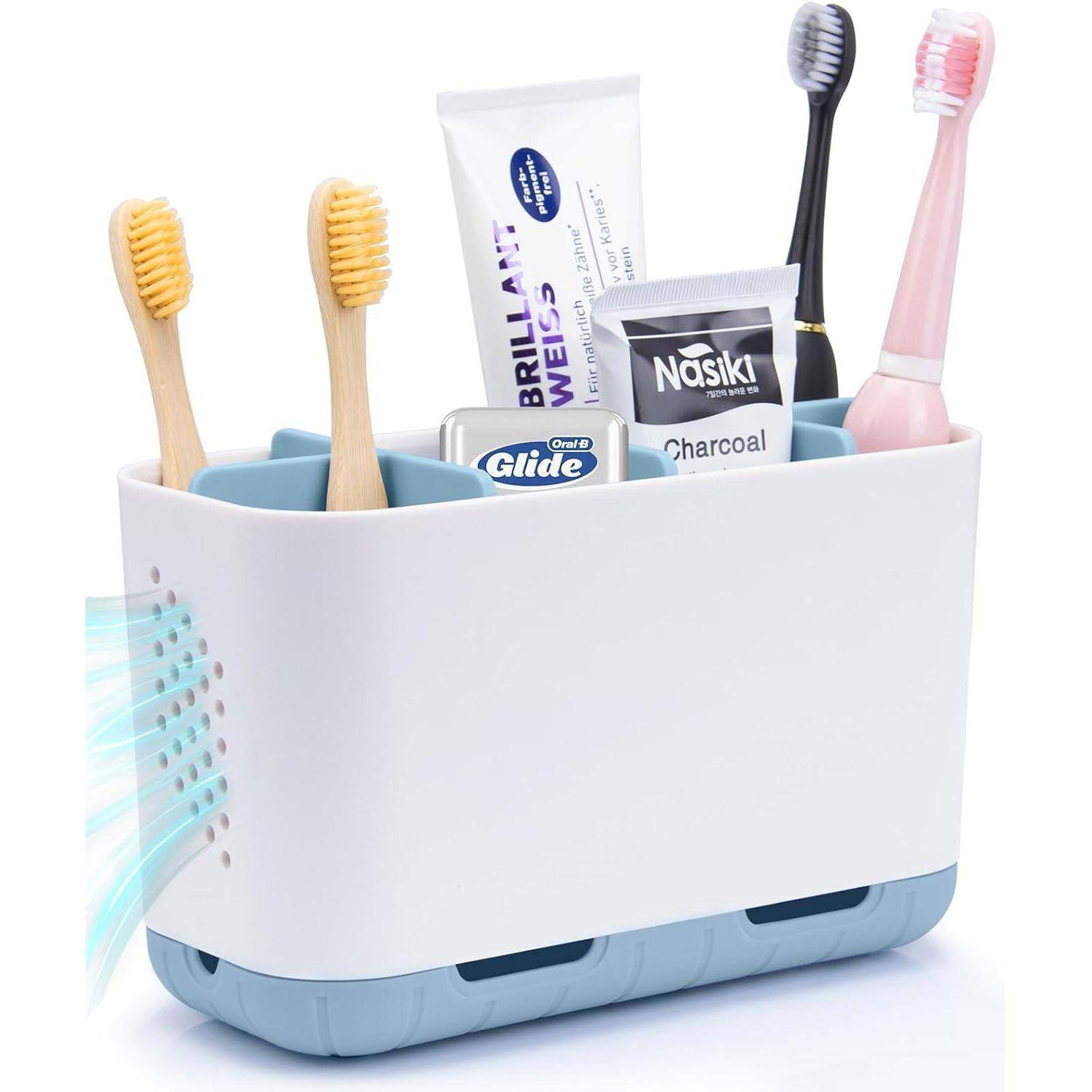 Weiße Arbeitsplatte Organizer mit belüfteter Seite und blauer Basis, der Zahnbürsten, Zahnpasta, Zahnseide-Picks und Zahnpastatuben hält.