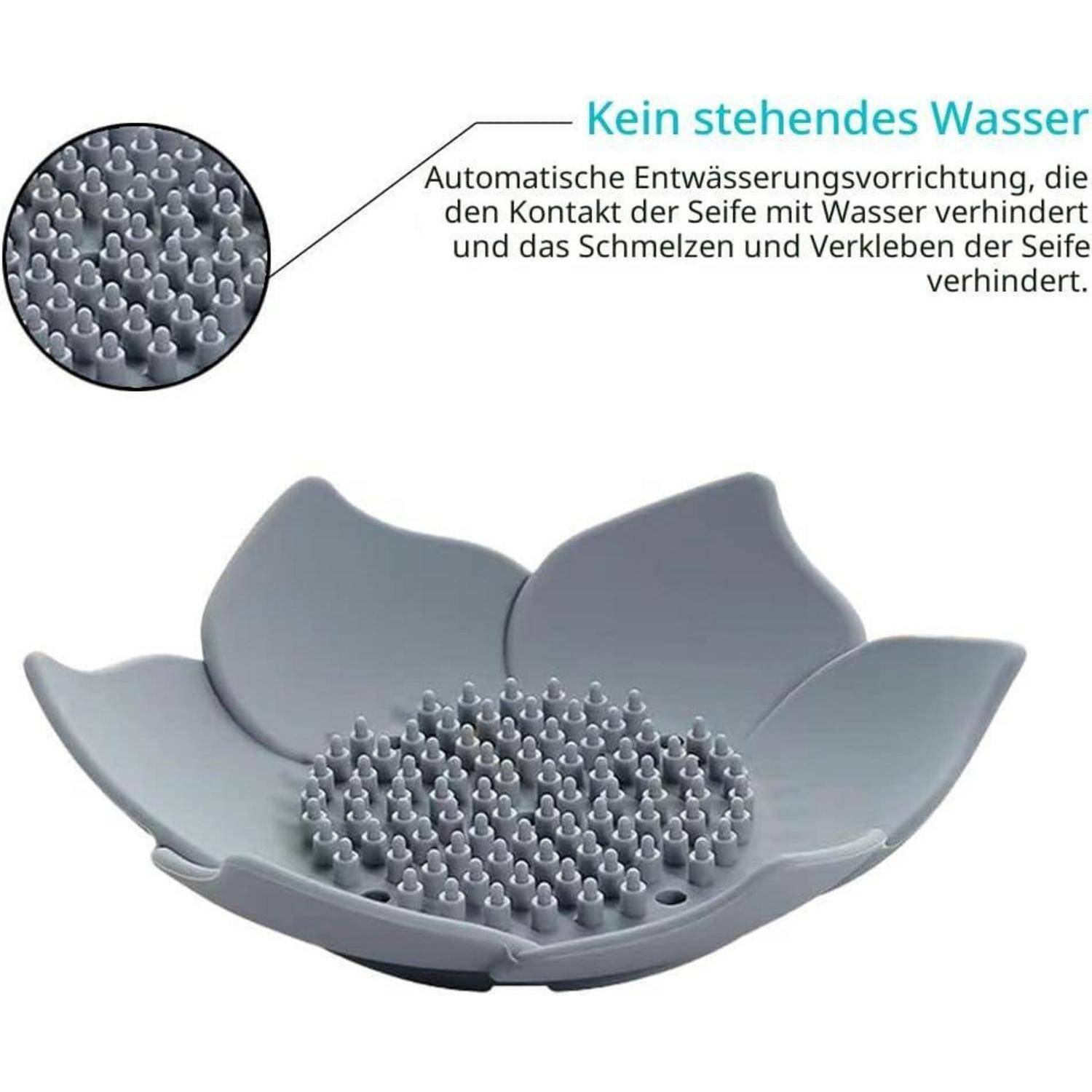 Grauer blütenförmiger Seifenhalter mit Drainagespitzen und Ausschnitt mit der Aufschrift „Kein stehendes Wasser