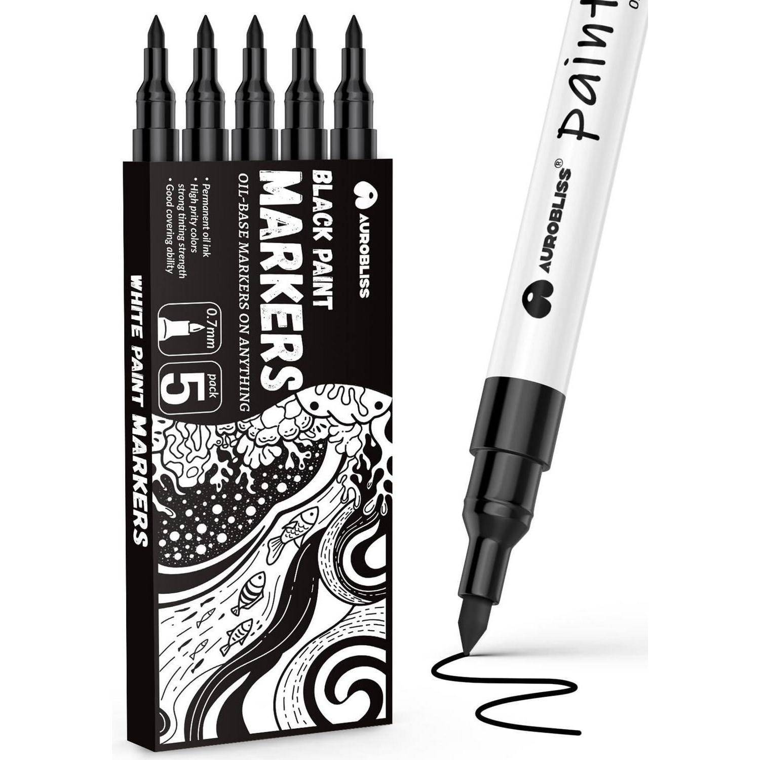 Ein Satz schwarzer Acrylfarb-Marker in einer Box, wobei ein Marker eine schwarze Linie auf weißem Papier zeichnet.