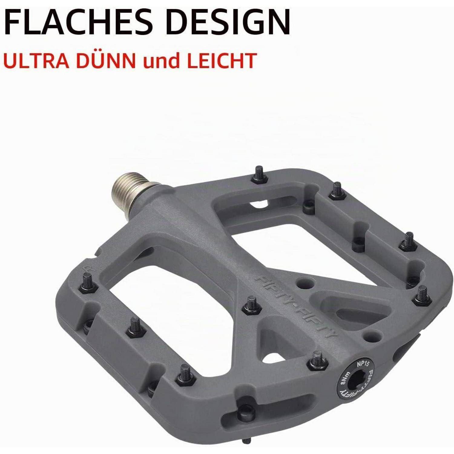 Graues Fahrradpedal mit flachem Design auf weißem Hintergrund, gekennzeichnet mit 'FLACHES DESIGN' und 'ULTRA DÜNN und LEICHT', um seine schlanke, leichte Bauweise zu betonen.