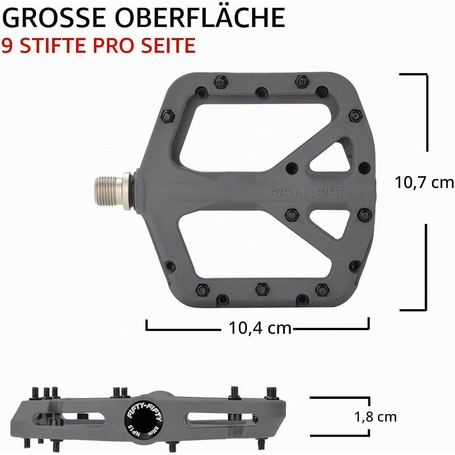 Graues Fahrradpedal in Frontal- und Seitenansicht dargestellt, gekennzeichnet mit „GROSSE OBERFLÄCHE" und „9 STIFTE PRO SEITE"", mit Abmessungen von 10,4 cm x 10,7 cm und 1,8 cm Dicke.