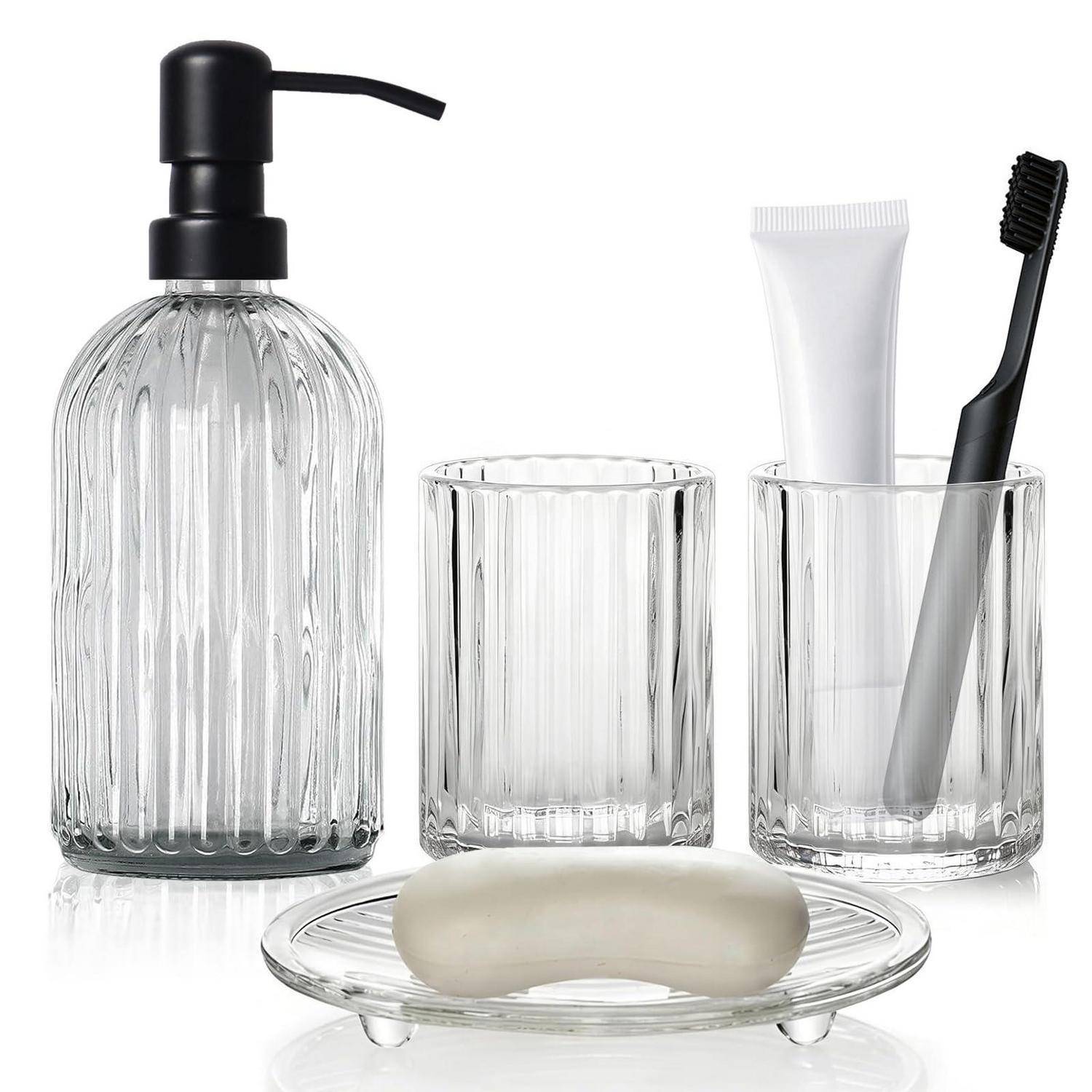 Glas-Badezimmerset mit Seifenspender, zwei Zahnputzbechern, Zahnbürstenhalter mit Zahnpasta und Zahnbürste sowie Seifenschale mit Stück Seife