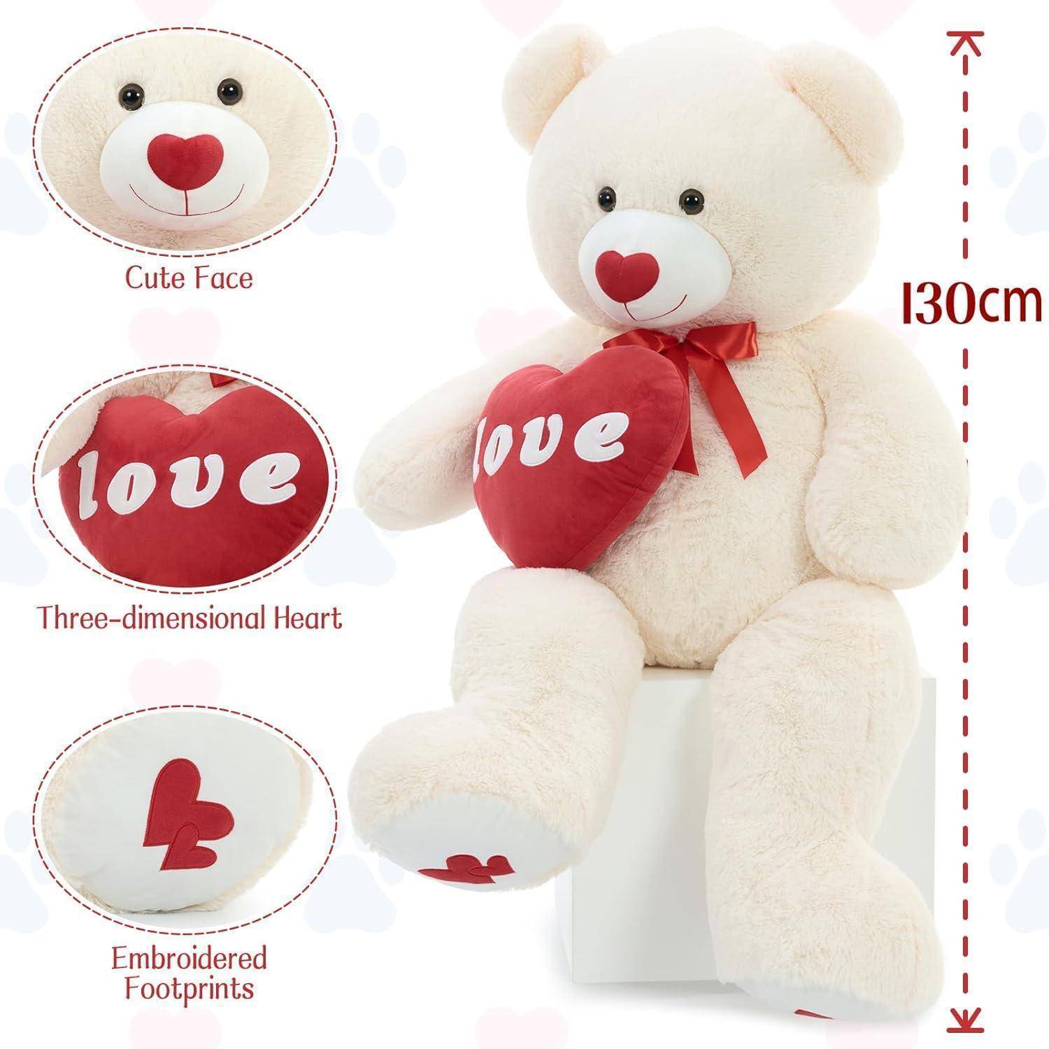 Weißer Teddybär, der ein rotes 