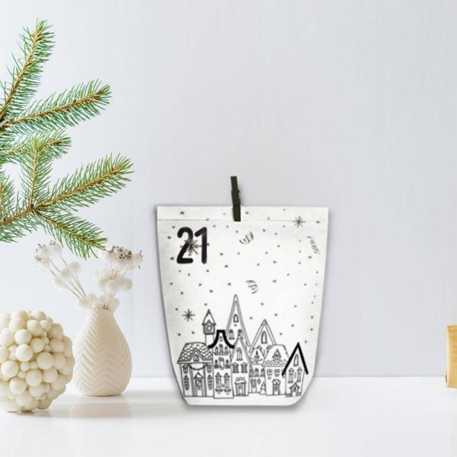 Eine dekorative Papiertüte für einen Adventskalender mit der Aufschrift „21