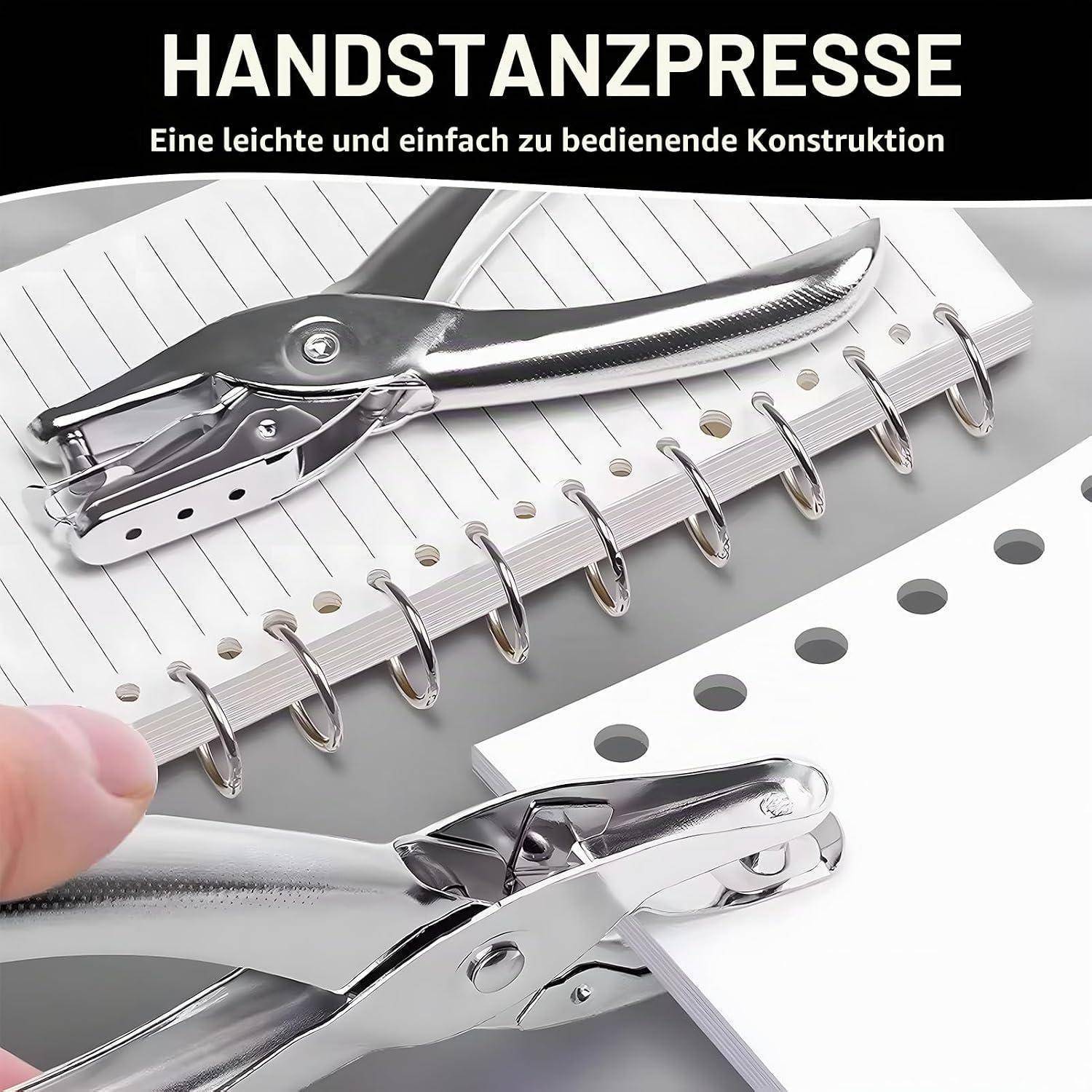 Chrome-Handstanzpresse auf weißen Papierblättern in einem spiralgebundenen Stapel; Deutscher Text lautet „HANDSTANZPRESSE