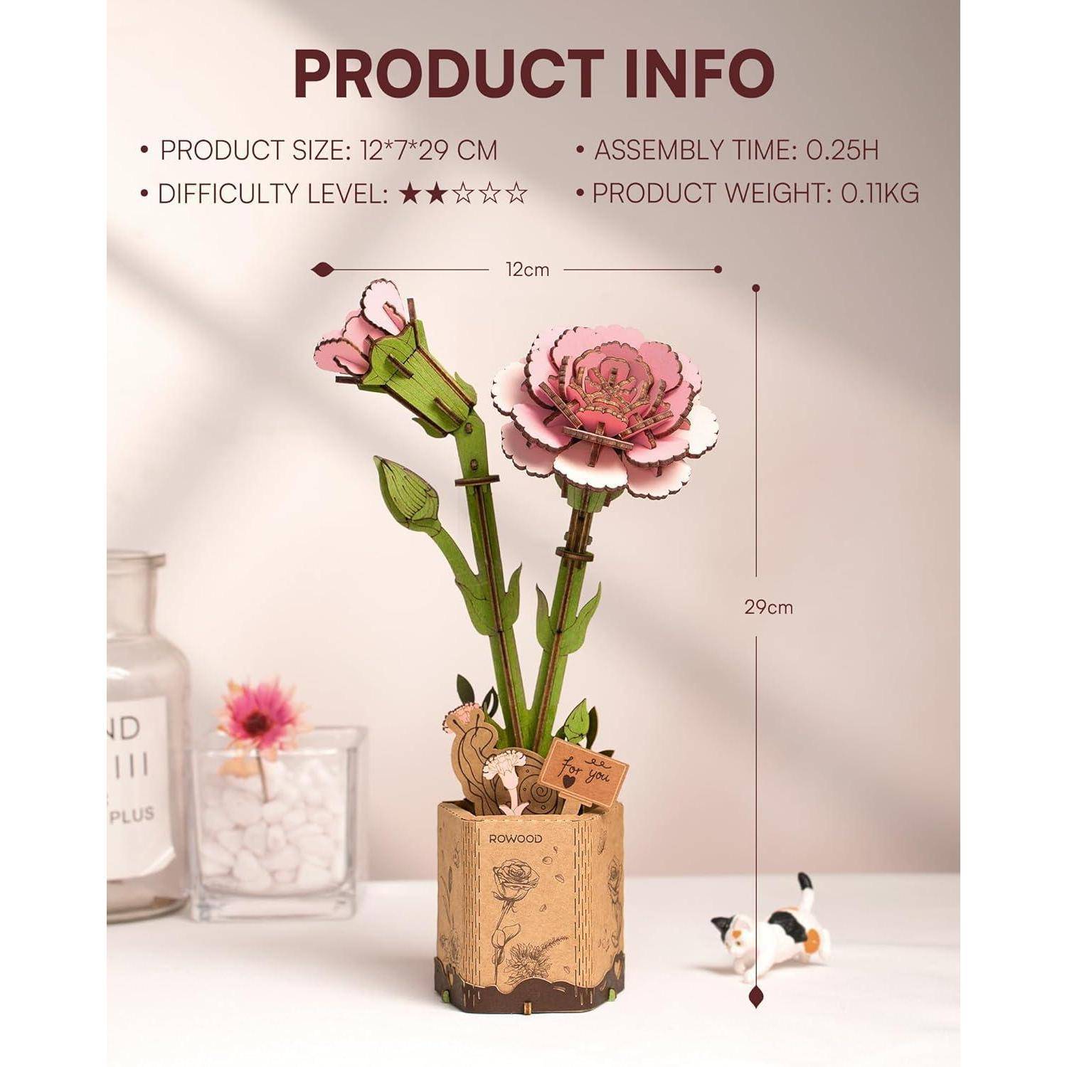 Produktinformationsbild mit einem rosafarbenen Blumen-Pop-up-Modell auf einer Holzbasis; der Text listet die Größe 12 x 29 cm, Montagezeit 0,25H, Schwierigkeitsgrad 2/5 und Gewicht 0,11 kg auf.