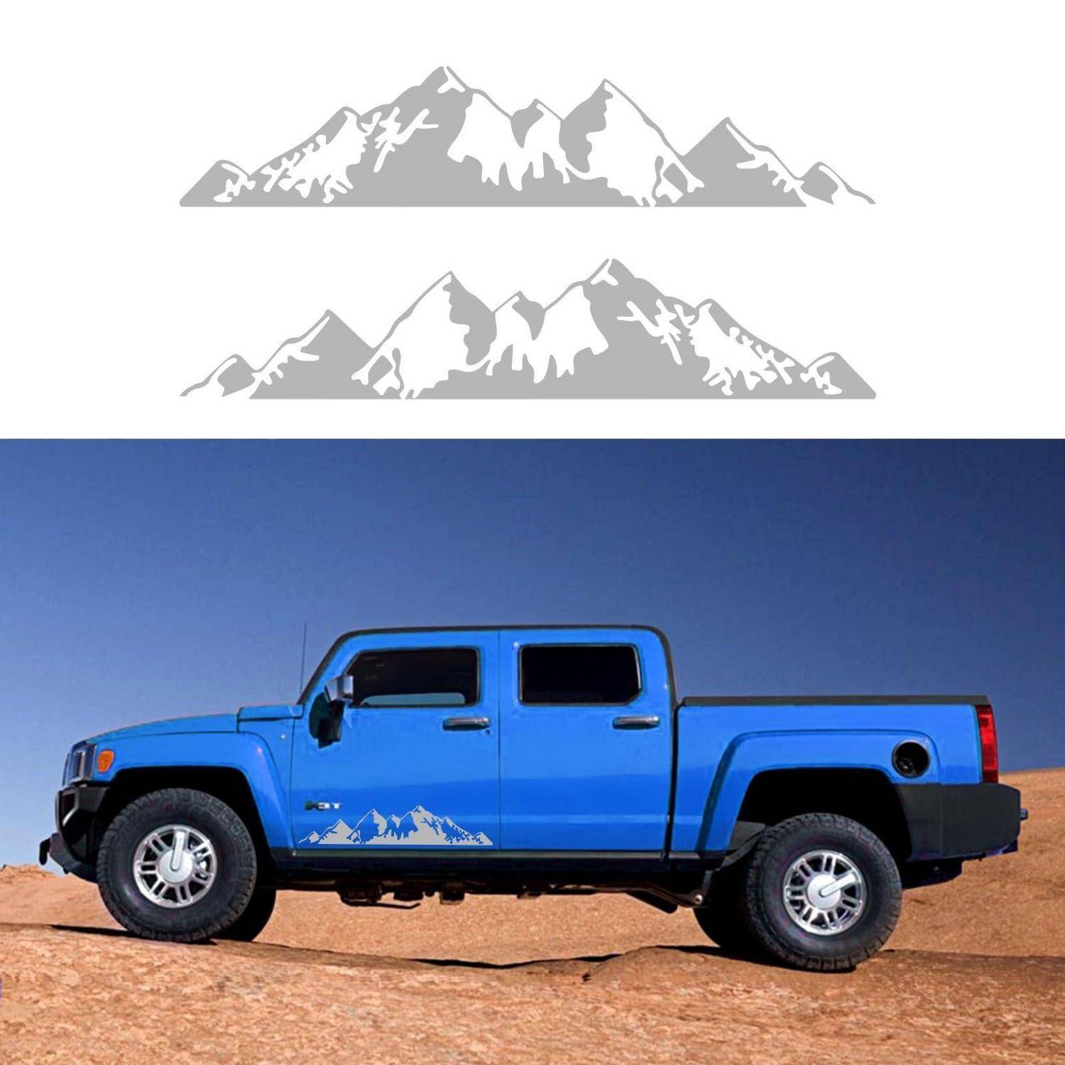 Blauer Pickup-Truck mit Bergaufklebern, der unten zwei graue Berglogo-Grafiken zeigt.