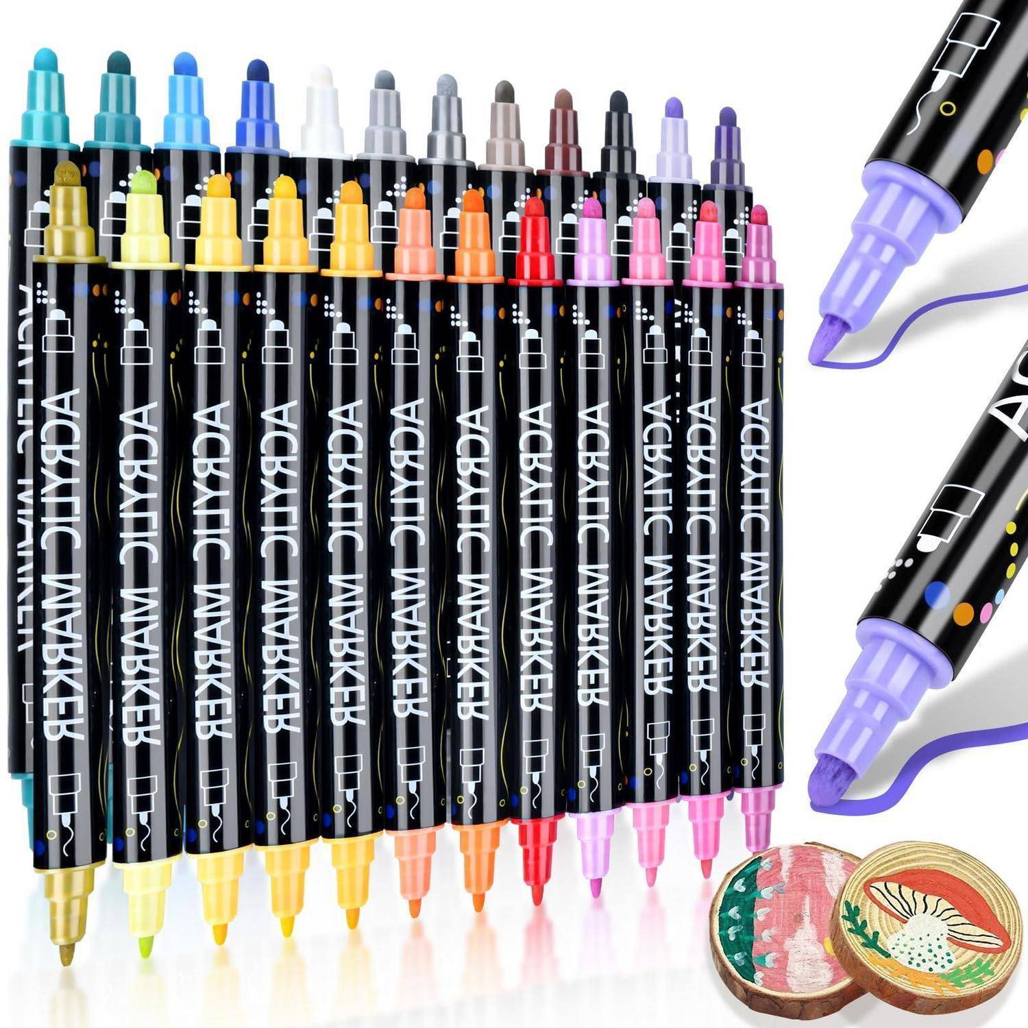 Sortierte schwarze Acrylmarker mit farbigen Kappen und Spitzen, plus zwei Marker-Nahaufnahmen auf der rechten Seite und ein kleines bemaltes rundes Handwerksstück darunter.