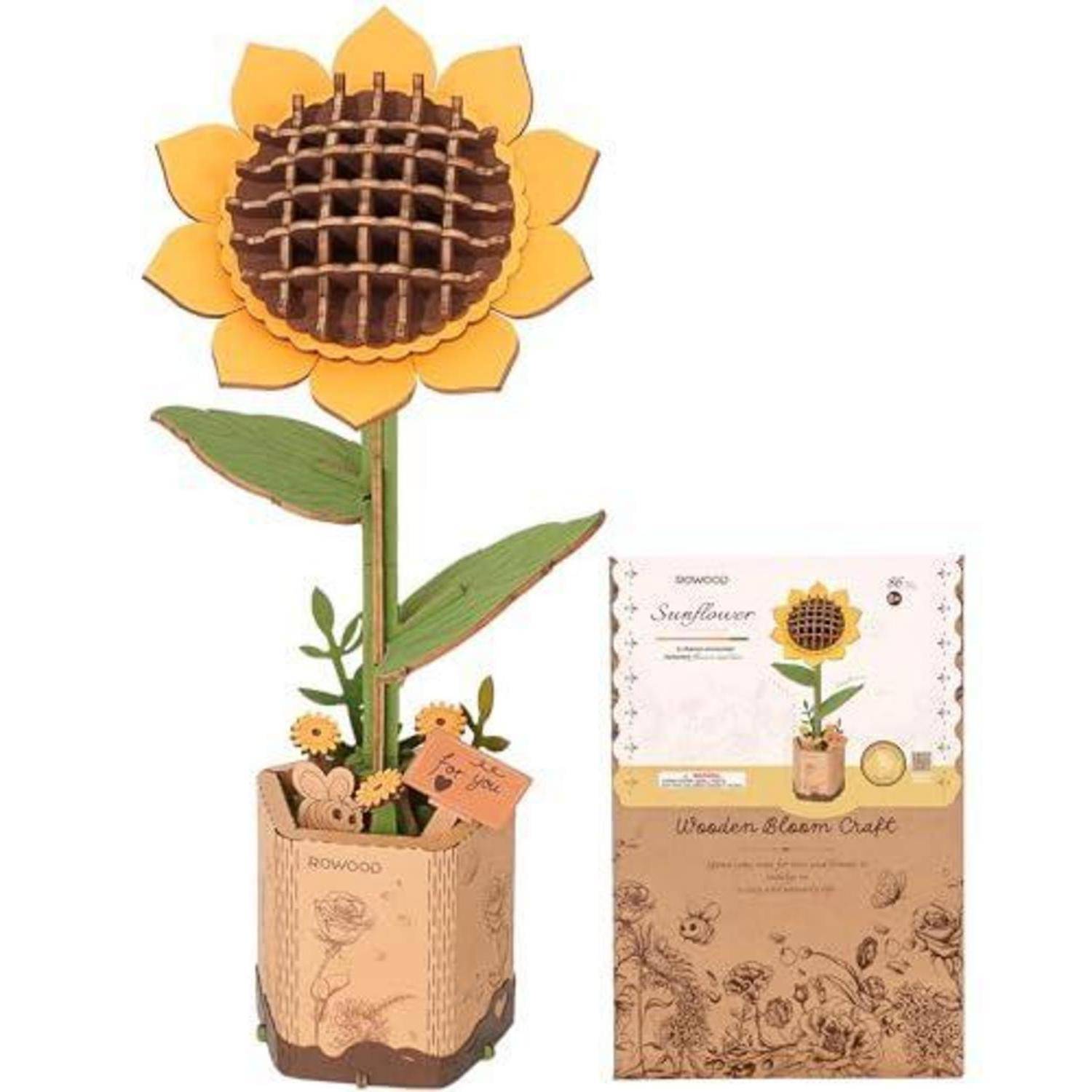 Hölzernes 3D-Sonnenblumen-Handwerk-Modell in einem Topf, gezeigt mit seiner Produktbox-Verpackung.