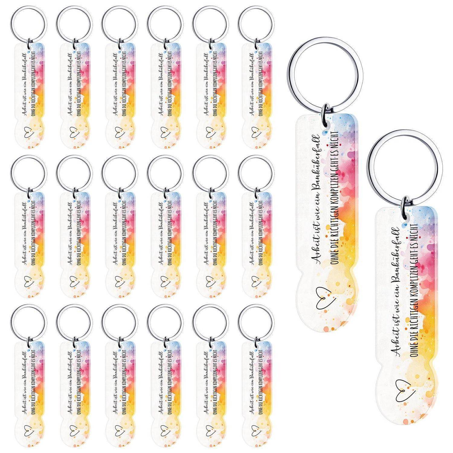 Collage aus farbenfrohen Acryl-Schlüsselanhänger-Lesezeichen mit Metallringen, die viele identische, schlanke Designs mit bedrucktem Zittattext und kleinen Herz-Akzenten auf weißem Hintergrund zeigen.