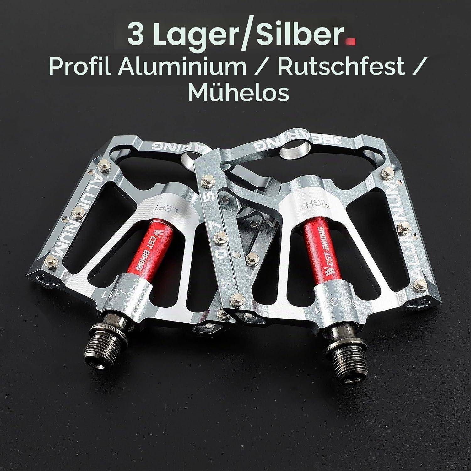 Paar silberner Aluminium-Fahrradpedale mit roten Reflektoren auf schwarzem Hintergrund, gekennzeichnet mit „3 Lager/Silber" und „Profil Aluminium / Rutschfest / Mühelos"".