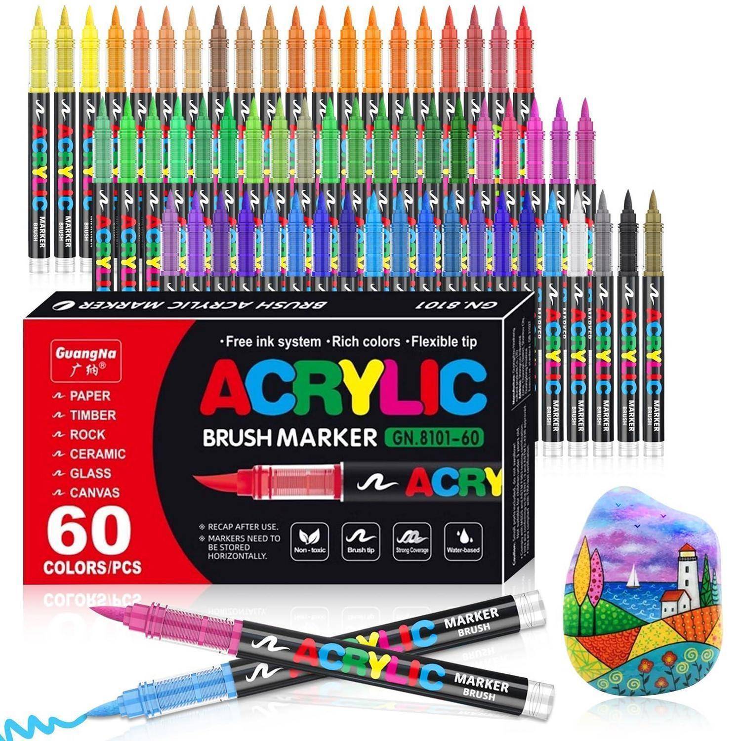 Packung mit 60 GuangNa Acrylmarker in verschiedenen Farben, mit Reihen von sichtbaren Markierstiften und einem bemalten Musterkiesel, das ein farbiges Landschaftsdesign zeigt.