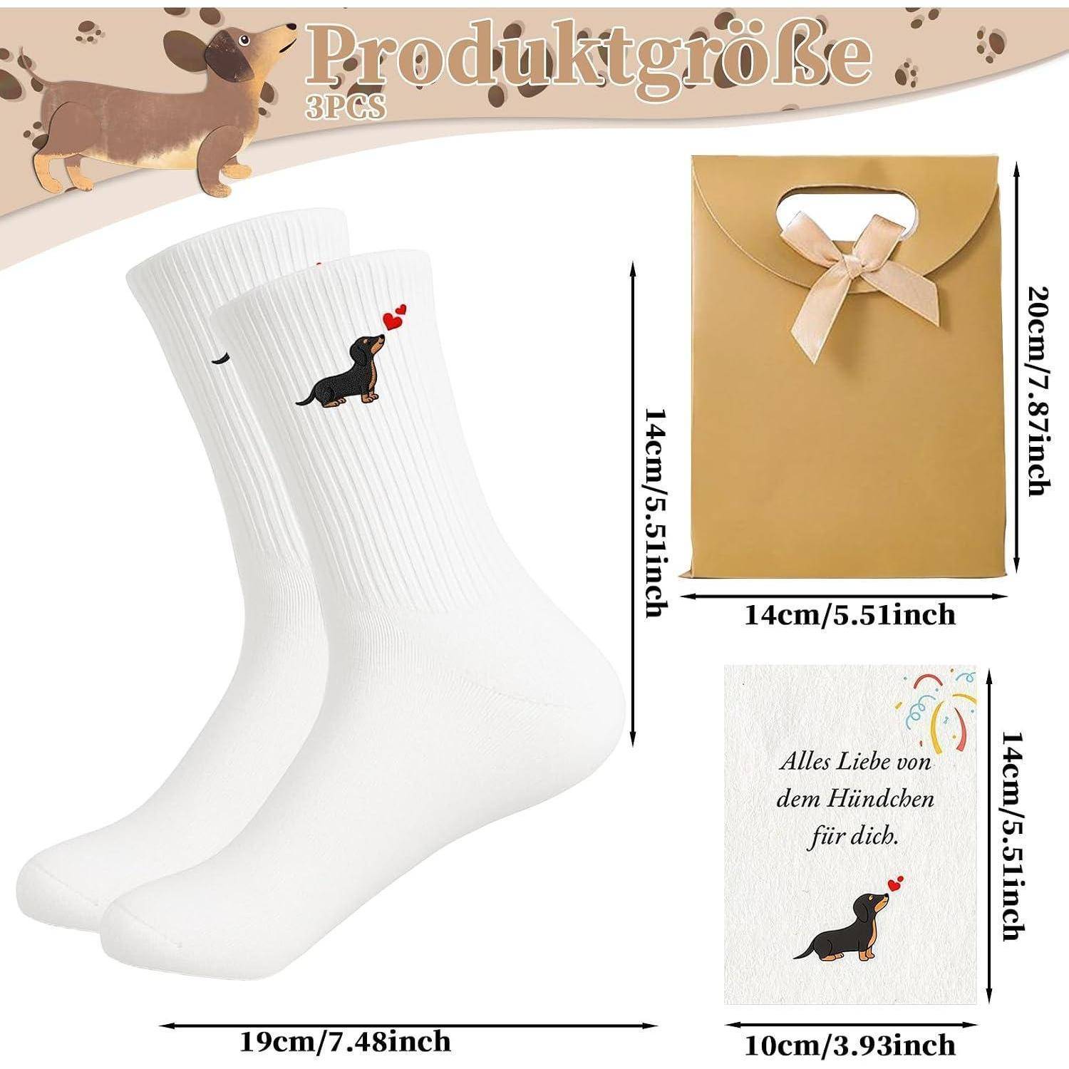 Produktgrößengrafik für 3 Paar hundedesign-Socken, zeigt weiße Socken, eine Geschenktüte und eine Karte mit Abmessungen in Zentimetern und Zoll gekennzeichnet.