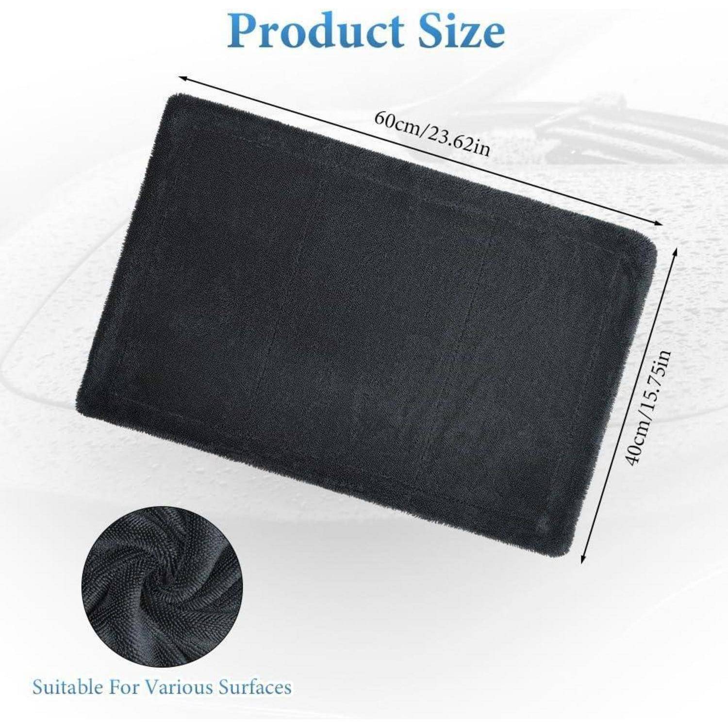 Produktgrößendiagramm einer schwarzen rechteckigen Matte oder eines Teppichs, mit den Maßen 60 cm/23,62 Zoll × 40 cm/15,75 Zoll, mit eingefügtem Detail der strukturierten Materialoberfläche und der Aufschrift „Für verschiedene Oberflächen geeignet".