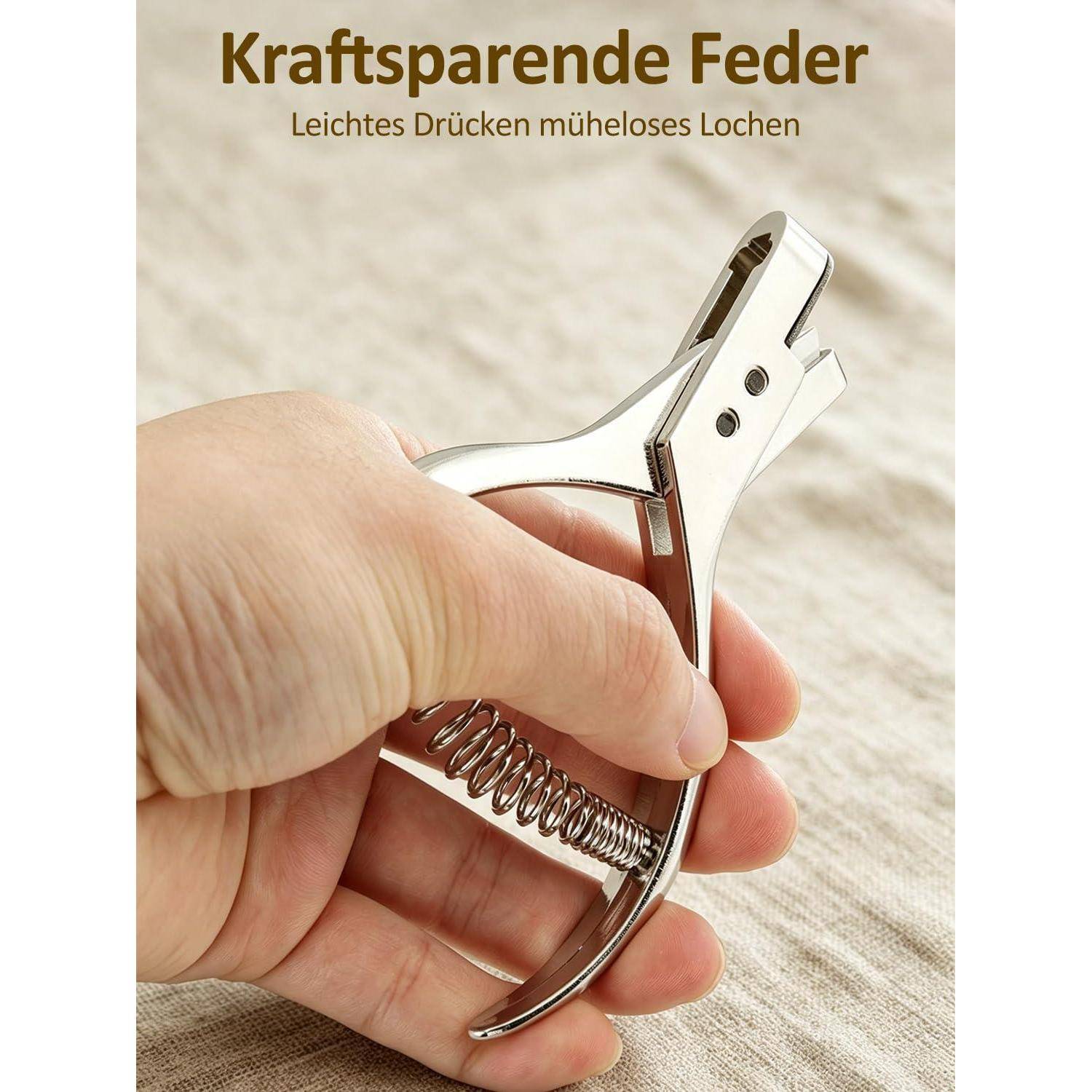 Hand hält ein federbelastetes Metalllochstanzgerät; deutscher Text liest „Kraftsparende Feder" und „Leichtes Drücken müheloses Lochen"".