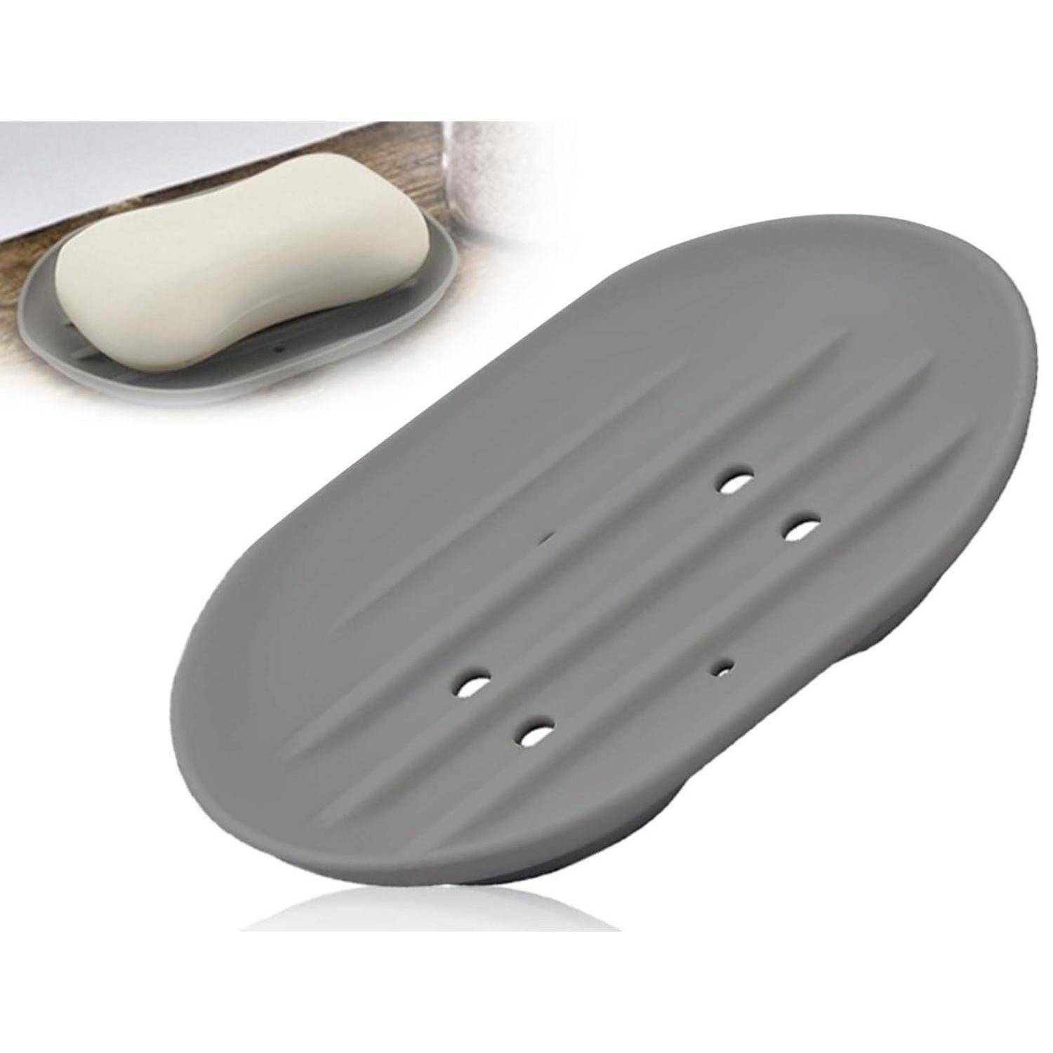 Graue Silikonseifenschale mit Drainagelöchern, gezeigt mit einem Stück Seife im vergrößerten Bild.