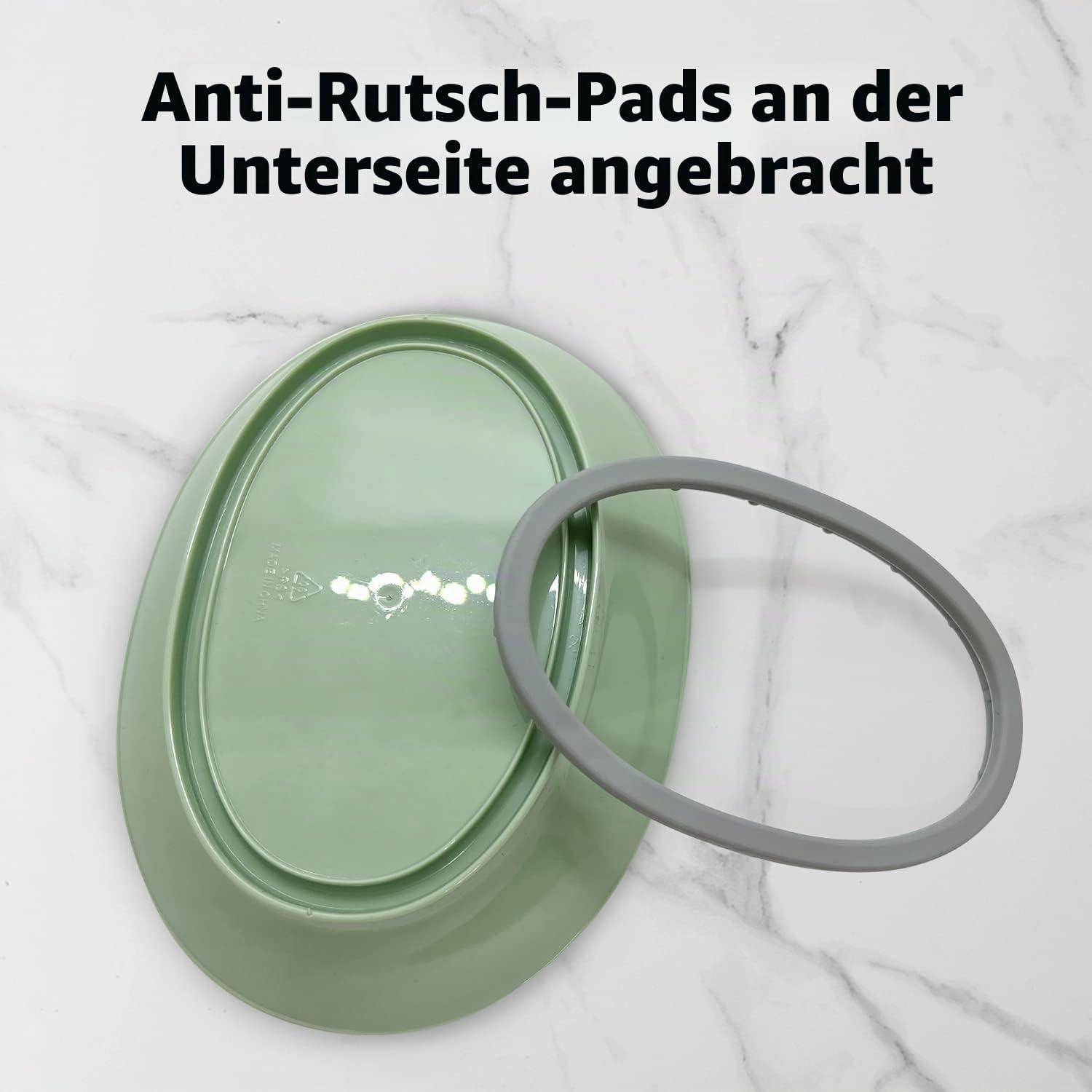 Grüne ovale Schüssel mit abnehmbarem grauem Ring; deutscher Text besagt „Anti-Rutsch-Pads an der Unterseite angebracht