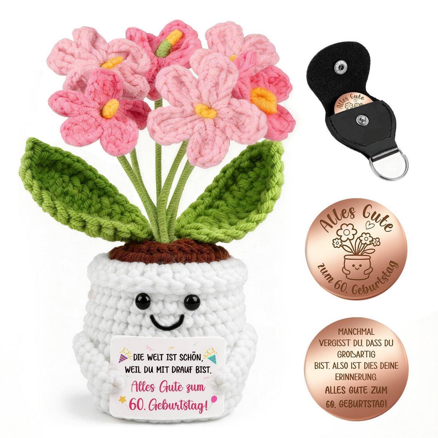 Gehäkelter Blumenstrauß in einem lächelnden weißen Topf mit einer Geburtstagsbotschaft, gezeigt mit einer schwarzen Geschenkbox und zwei personalisierten kupferfarbenen runden Anhängern.