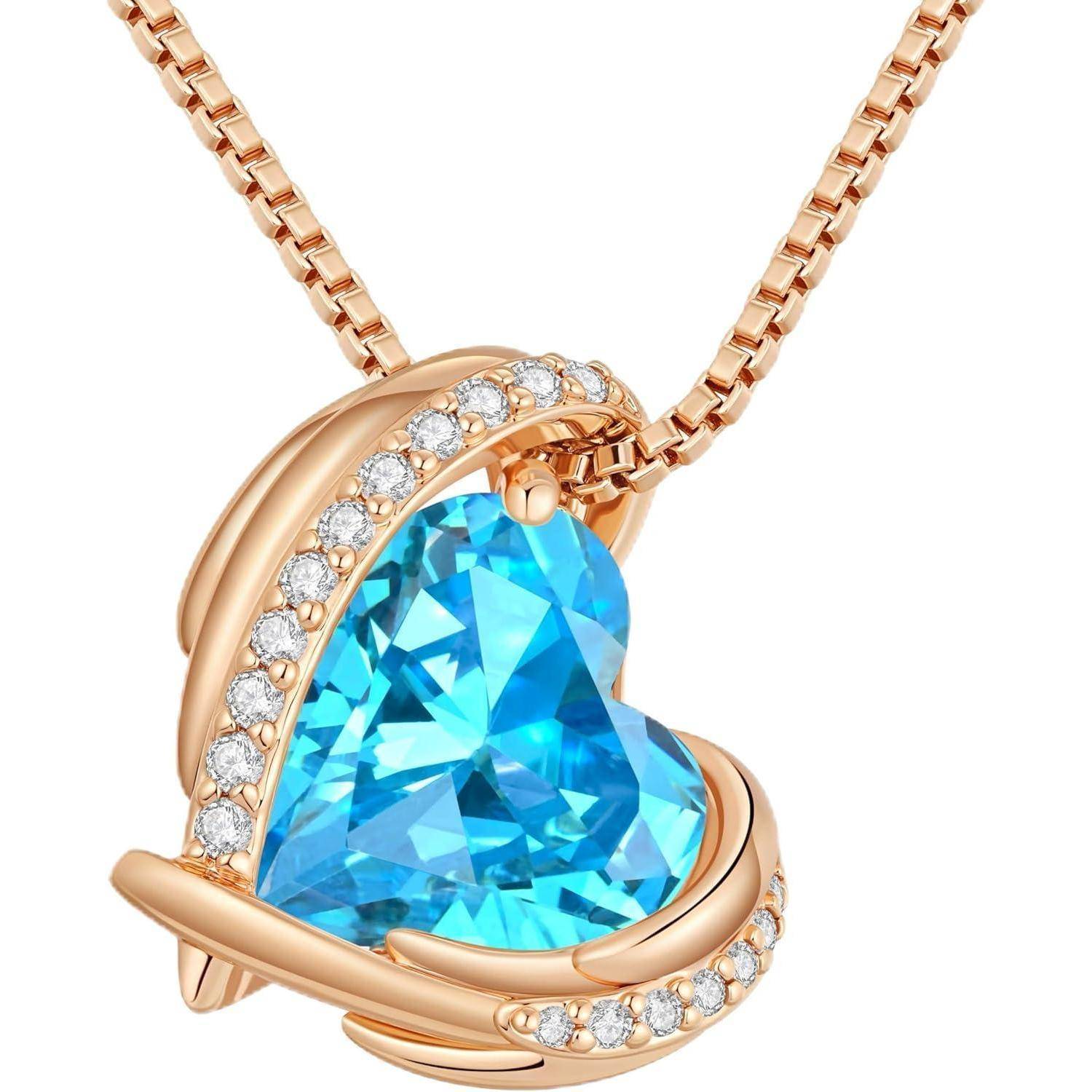Roségold-Herz-Anhängerkette mit großem blauen Edelstein und kleinen klaren Steinen in der Fassung und der Öse.