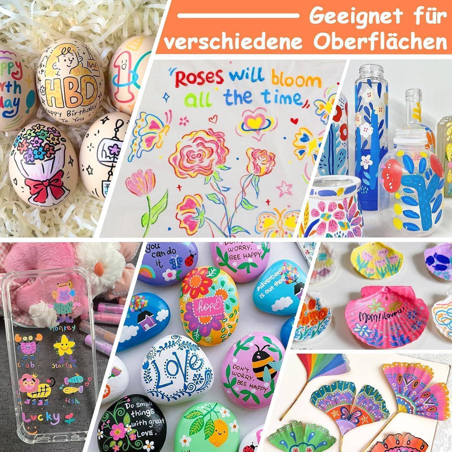 Collage aus bemalten Steinen, Flaschen und einem Hemd, das farbenfrohe handgemalte Designs und Beschriftungen auf verschiedenen Oberflächen zeigt.