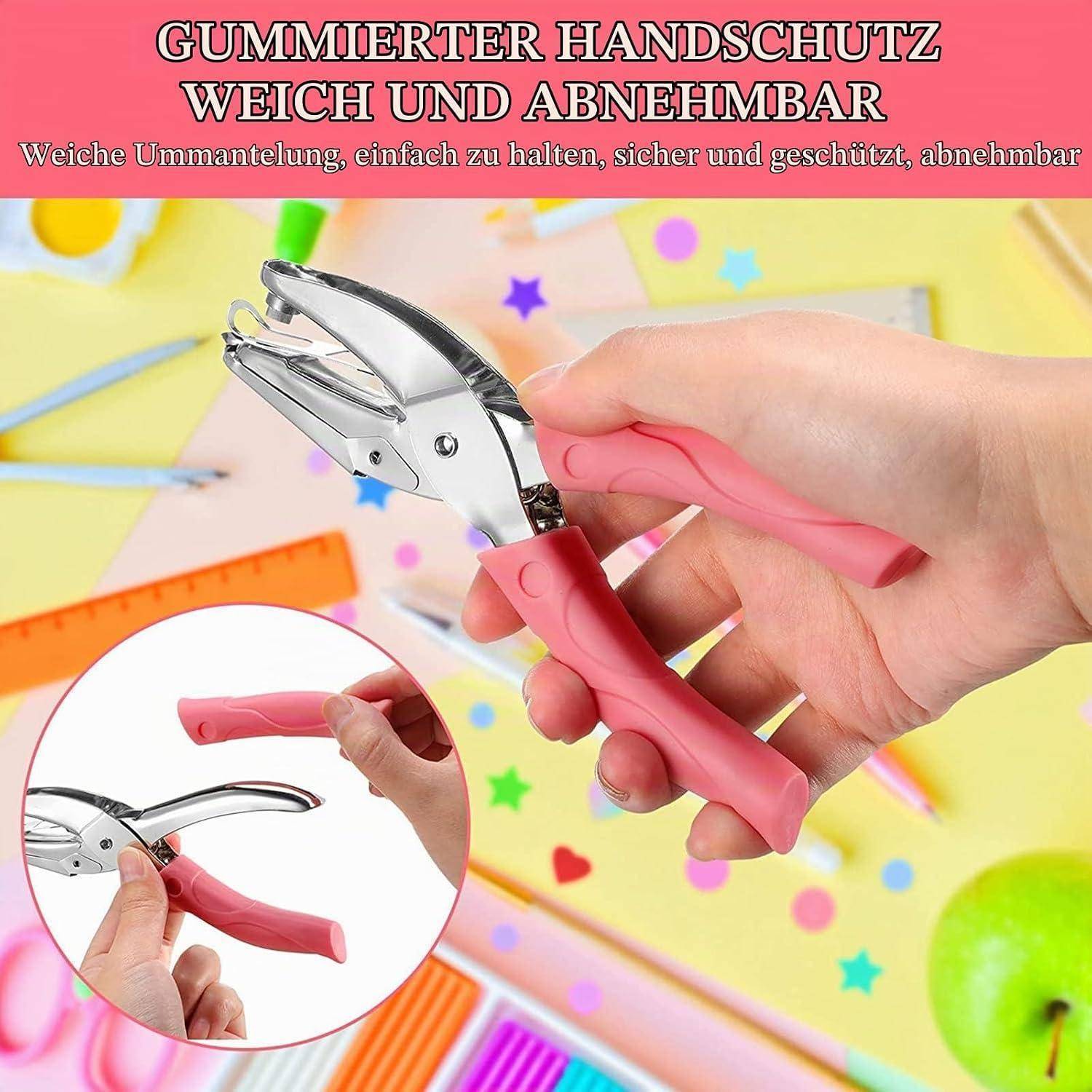Hand, die einen rosa gepolsterten Griff auf einem Metallhefter benutzt; Text besagt „GUMMIERTER HANDSCHUTZ WEICH UND ABNEHMBAR