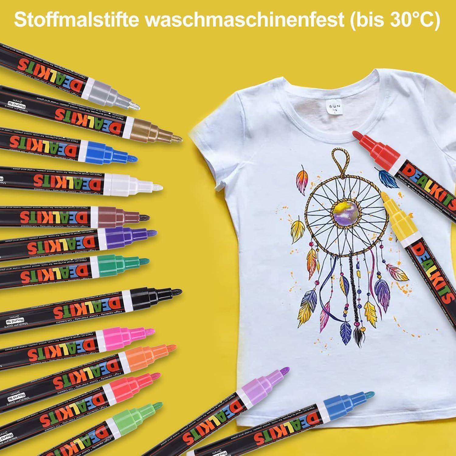 Weißes T-Shirt mit Traumfänger-Design, daneben bunte Stoffmarker; deutscher Text besagt, dass es bis 30°C waschfest ist.